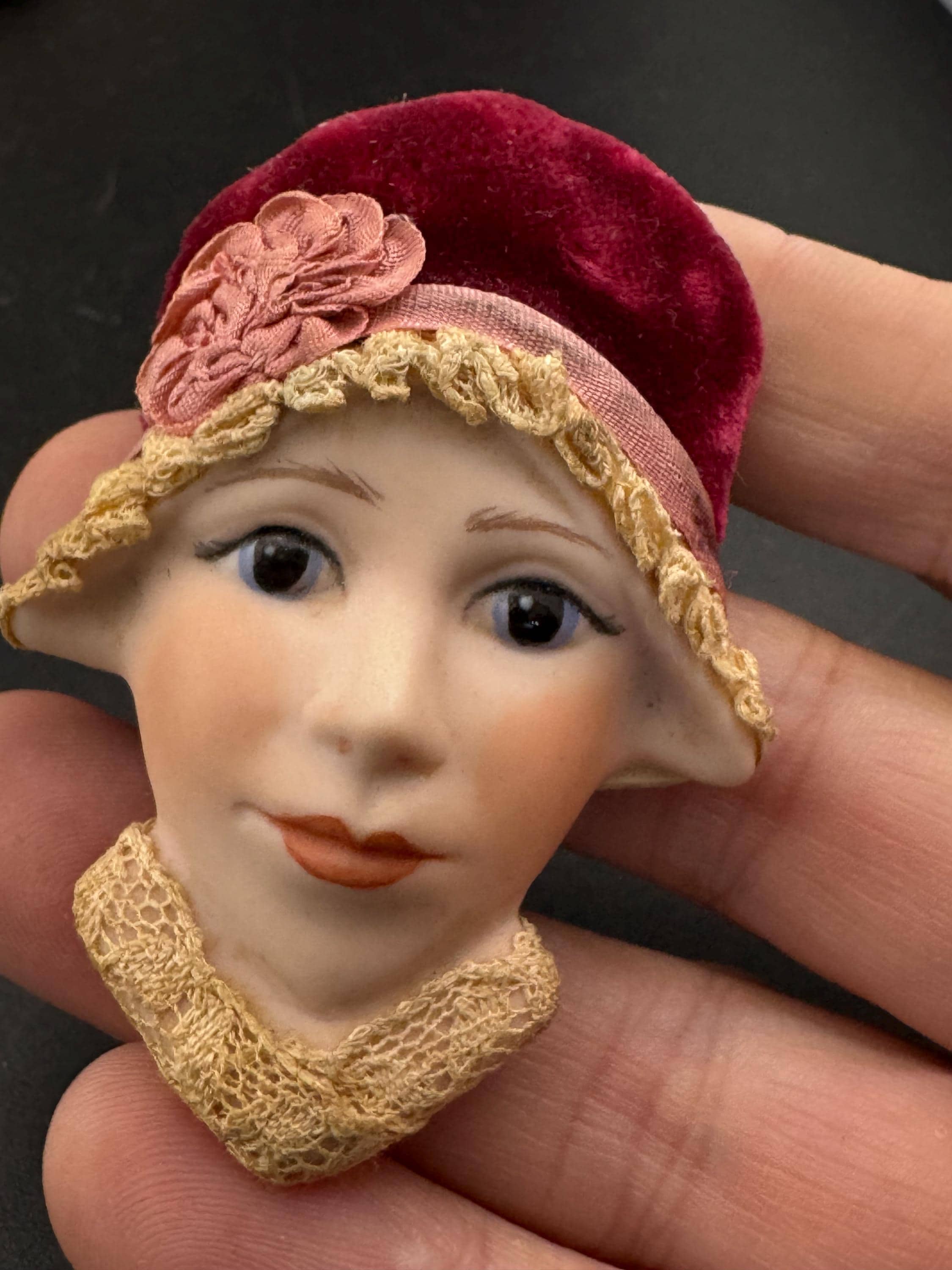 Vintage ceramic flapper face brooch: art deco with red velvet hat
