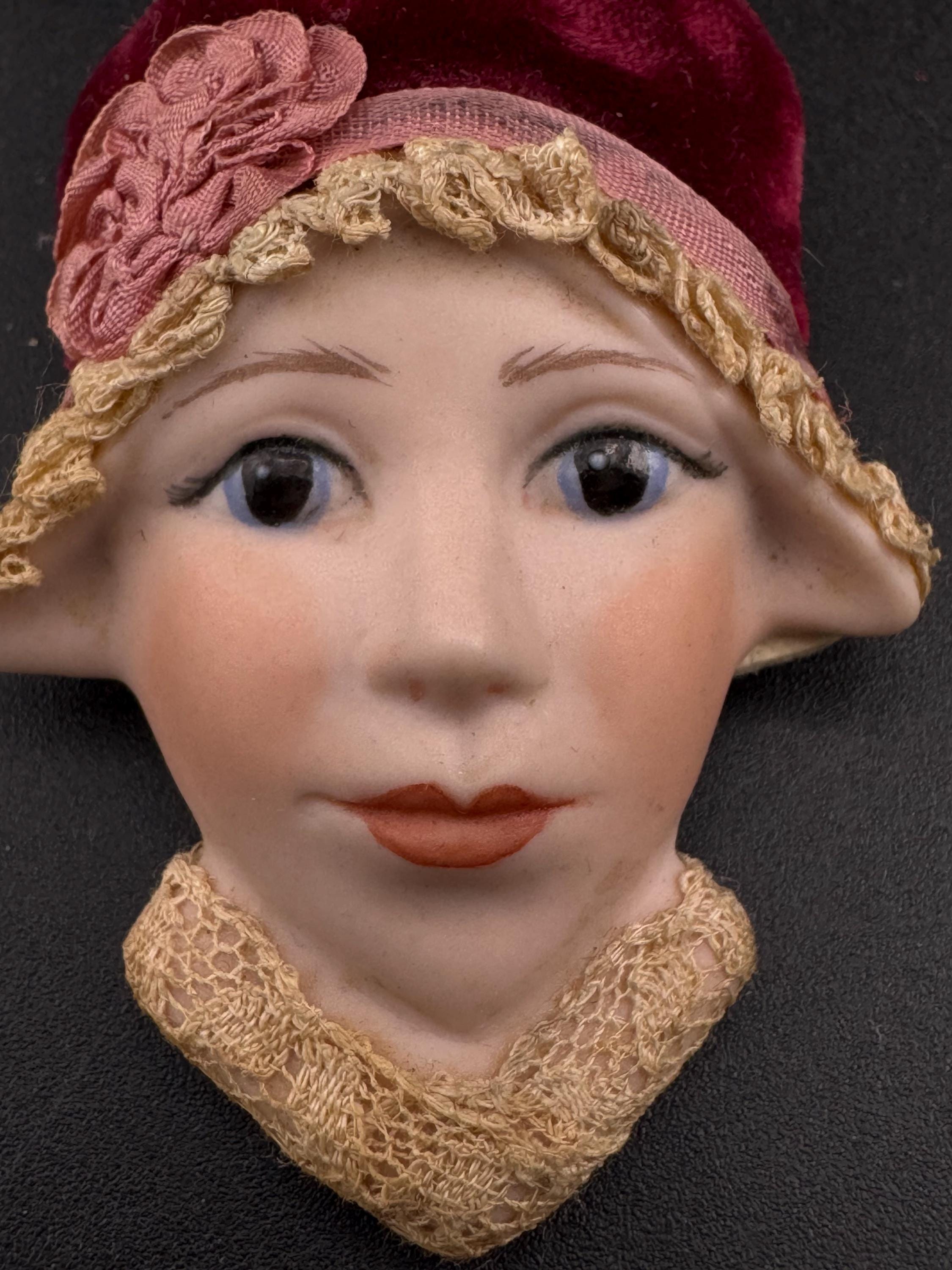 Vintage ceramic flapper face brooch: art deco with red velvet hat