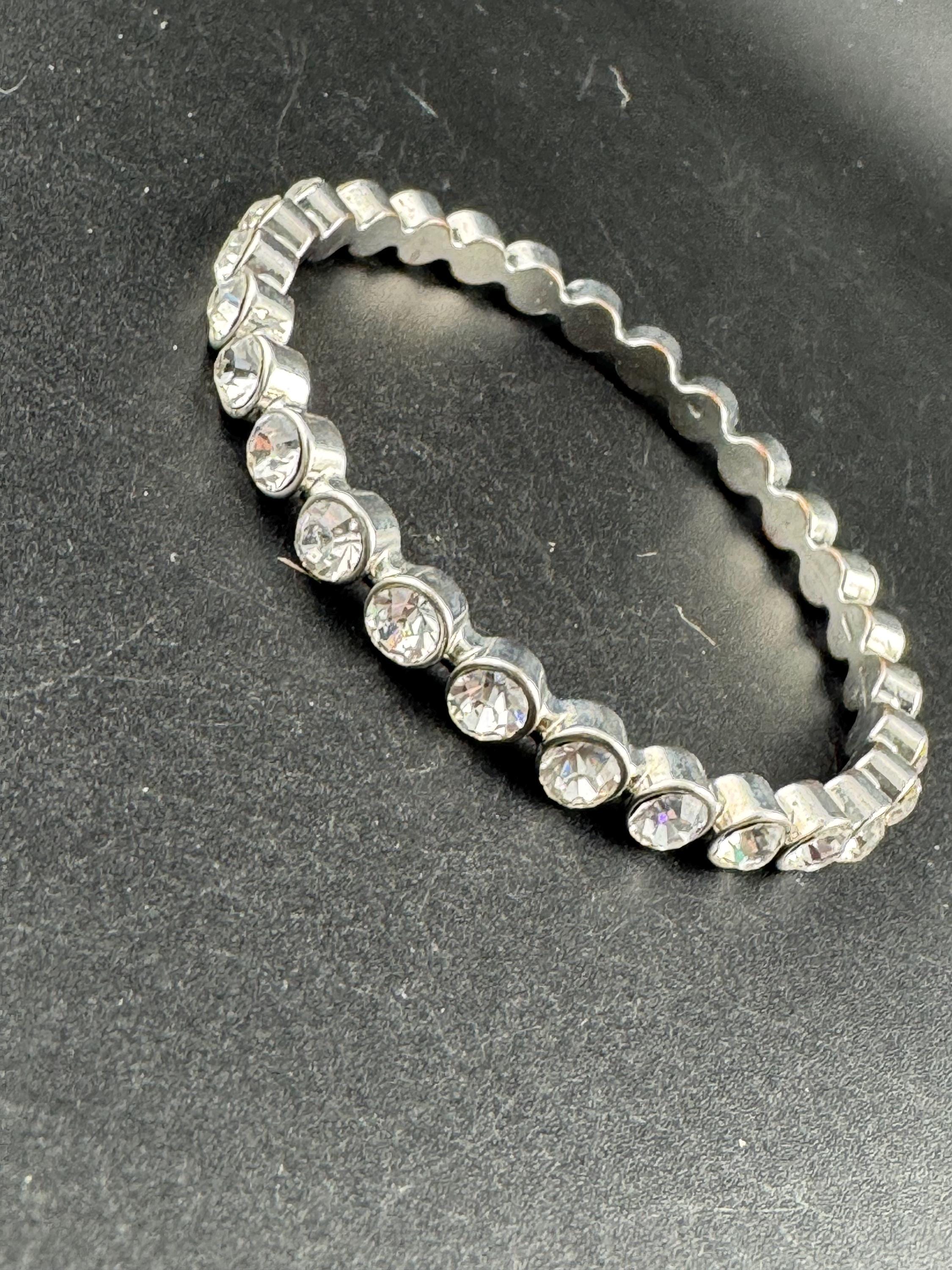 Fixed bezel link bangle with clear diamanté , silver tone bracelet