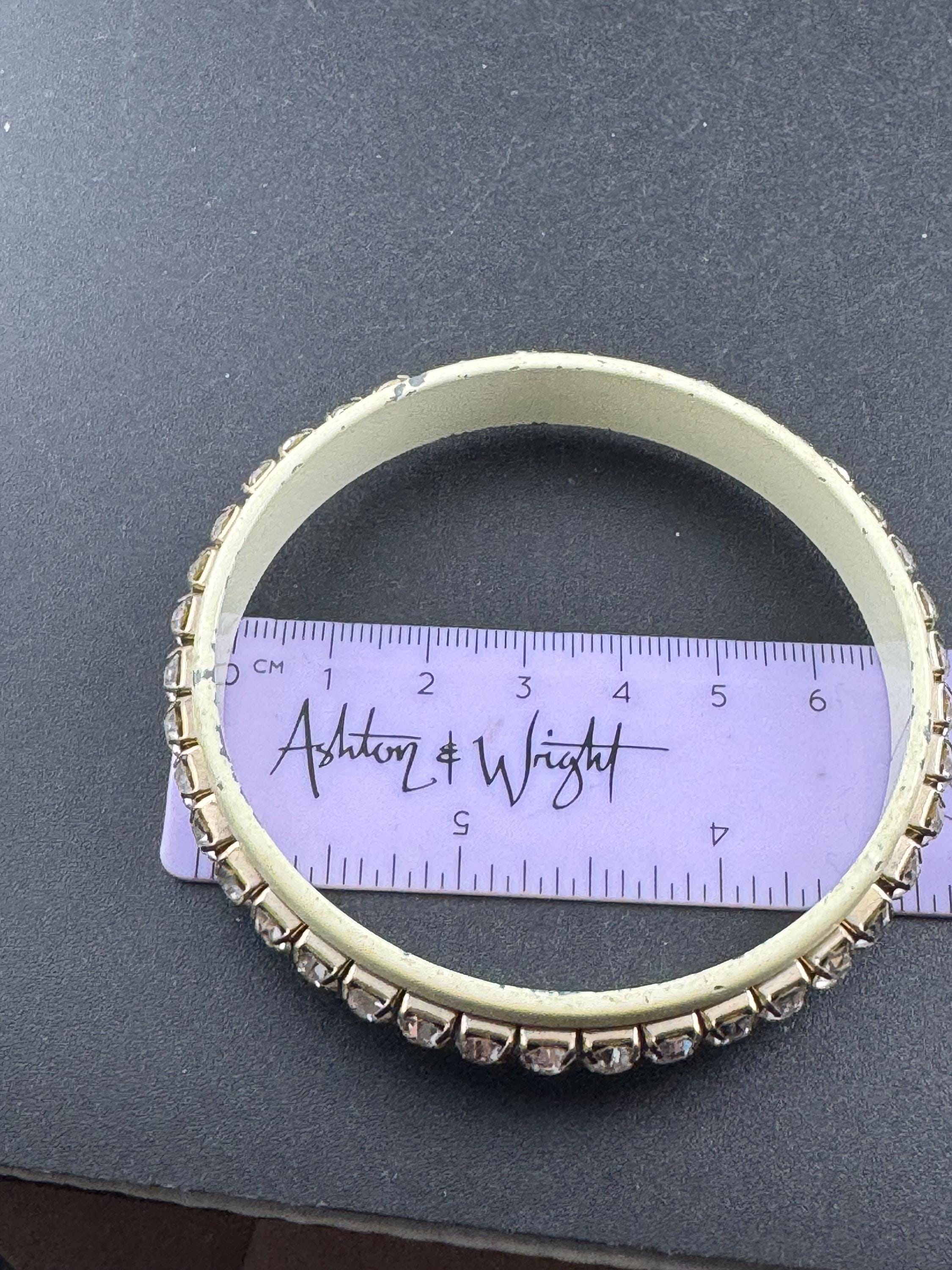 1960s cream enamel and clear diamanté fixed, slim bangle bracelet with wear