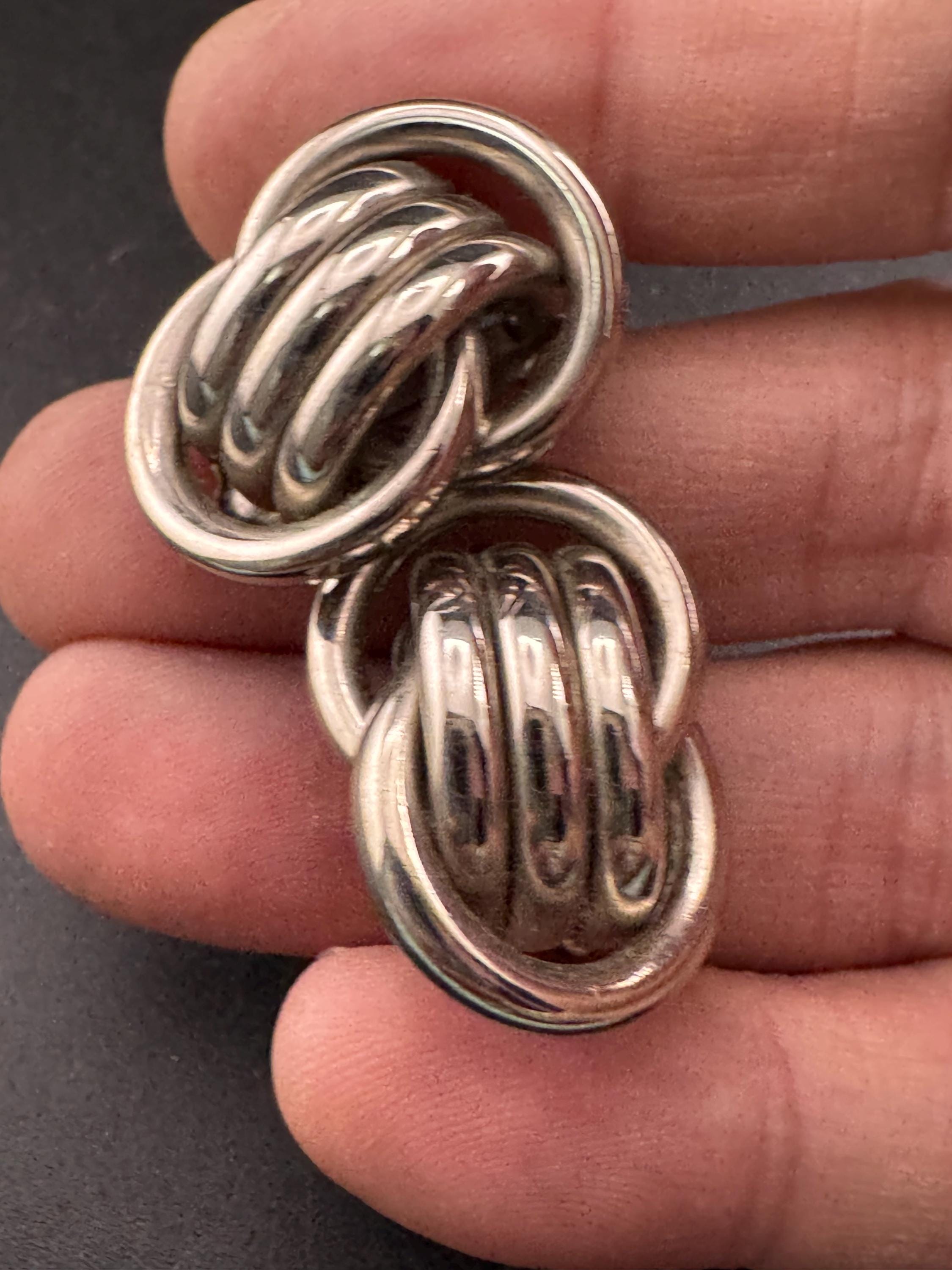1980s vintage metal tube knot clip on earrings, silver tone