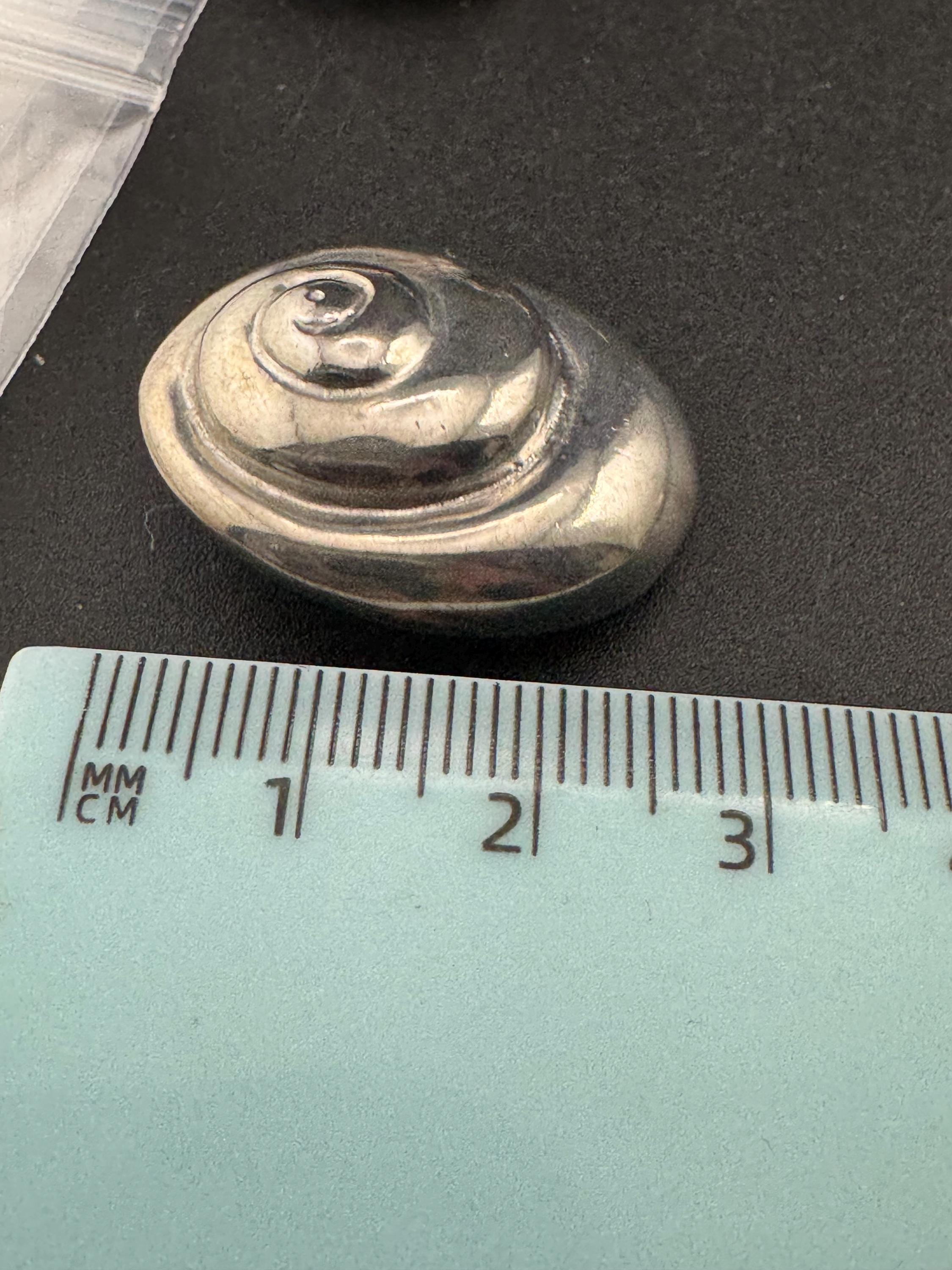Vintage swirl seashell clip on earrings, silver tone metal studs