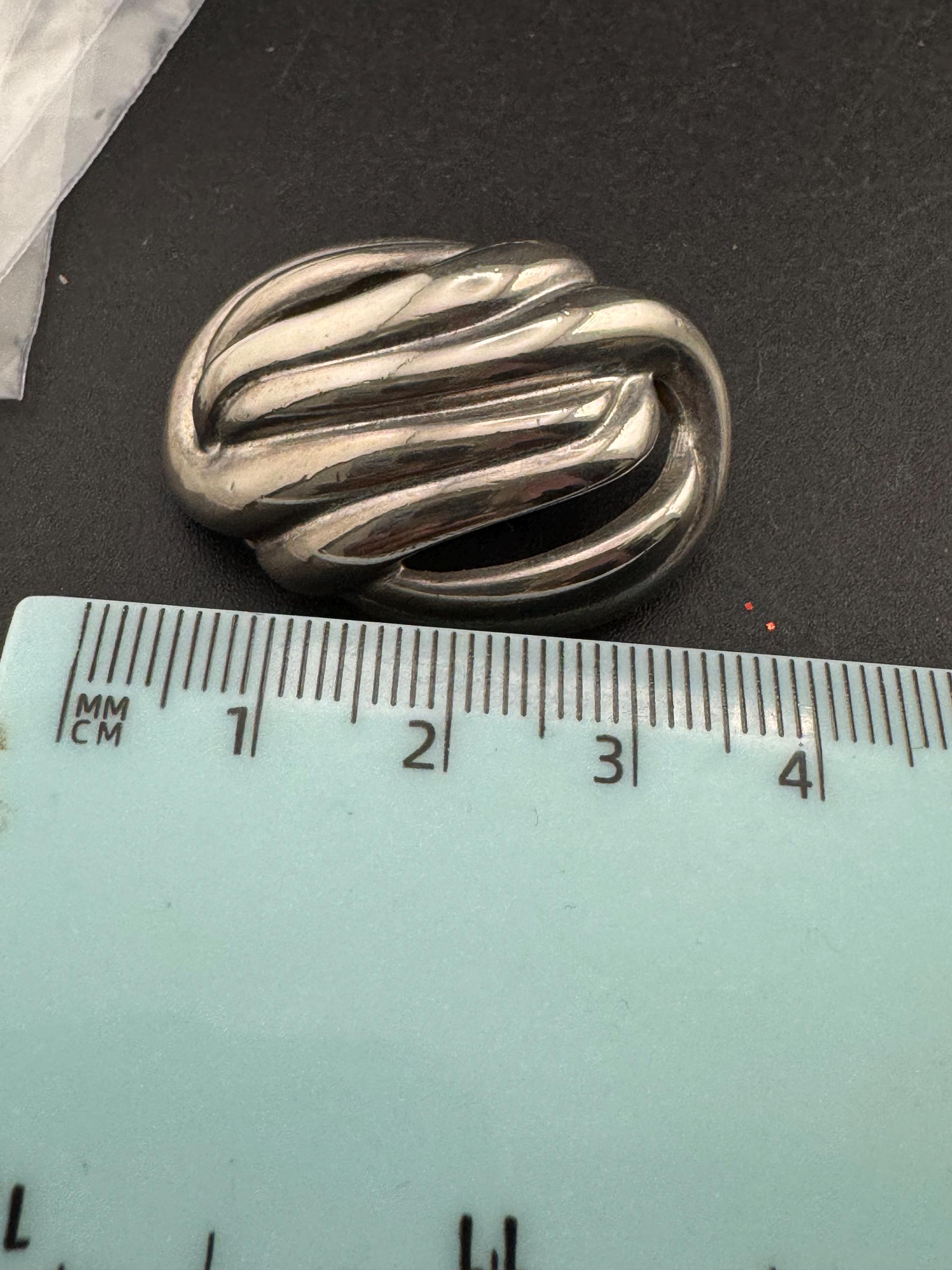 Vintage oversized silver metal swirl clip on earrings, 1980s