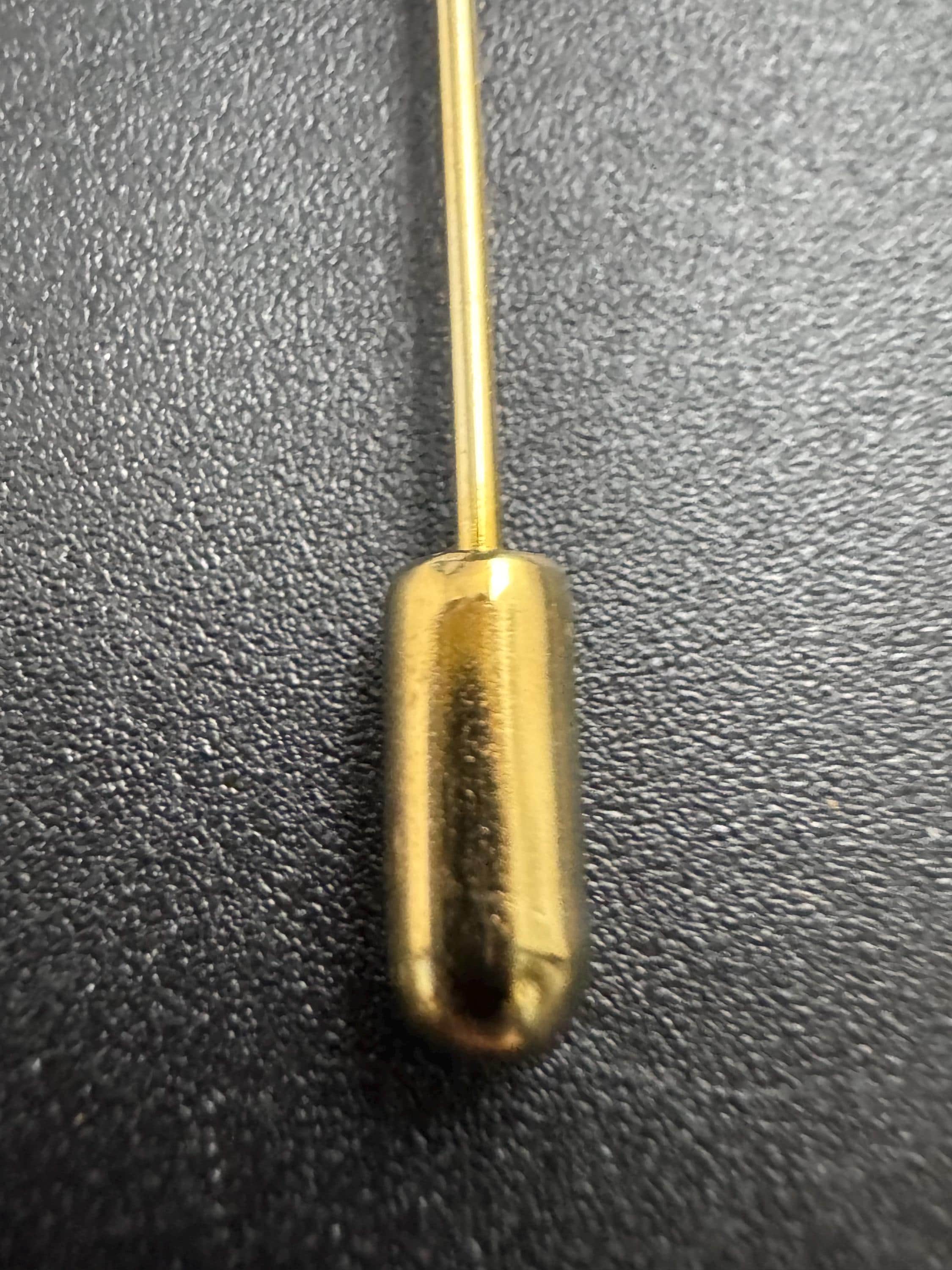 Vintage Un Jour Ailleurs Hat Pin: Gold plated Pillar Brooch from Paris