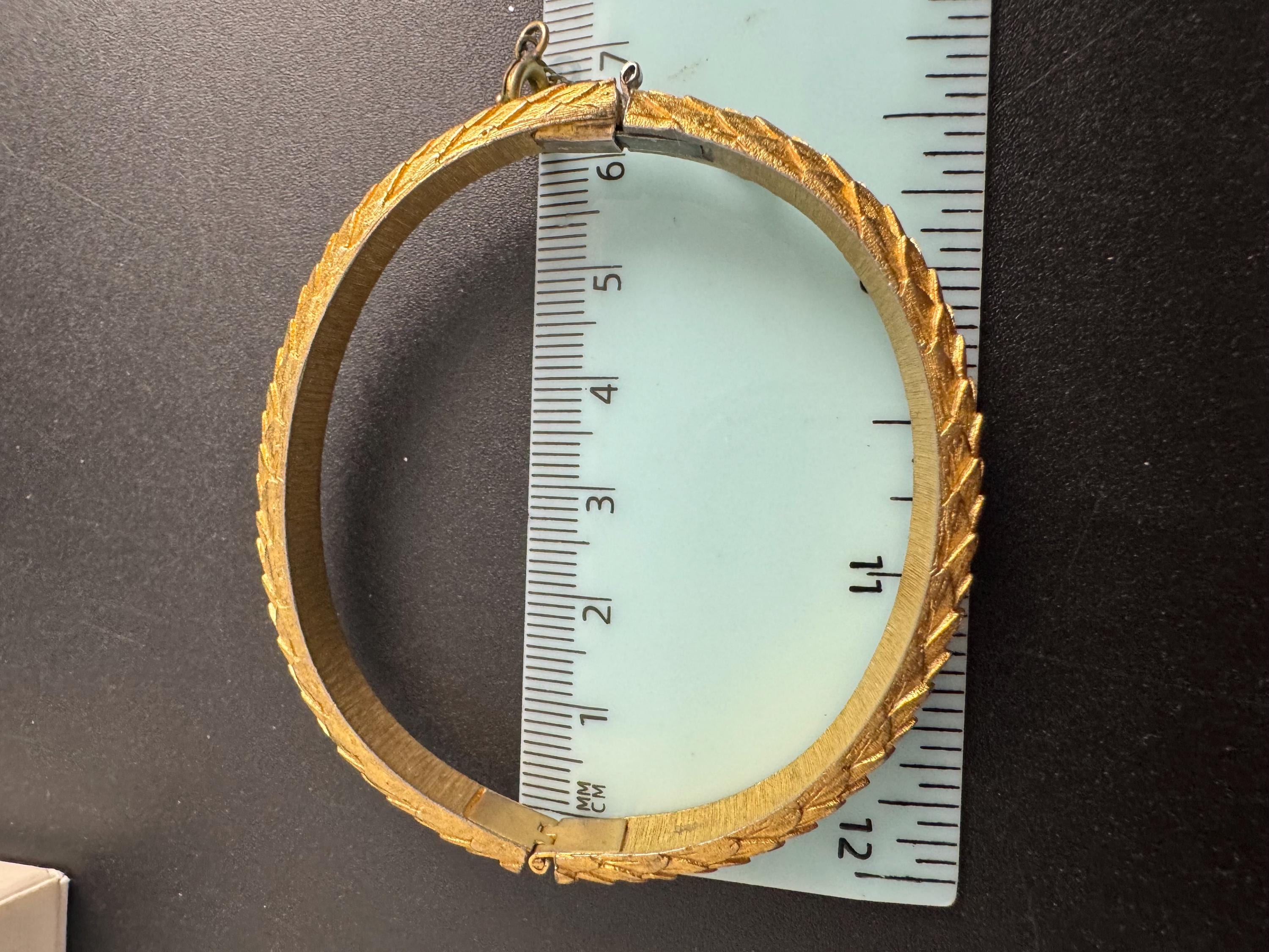 Crown Trifari gold-tone hinged bangle bracelet, textured snake or fish scale pattern