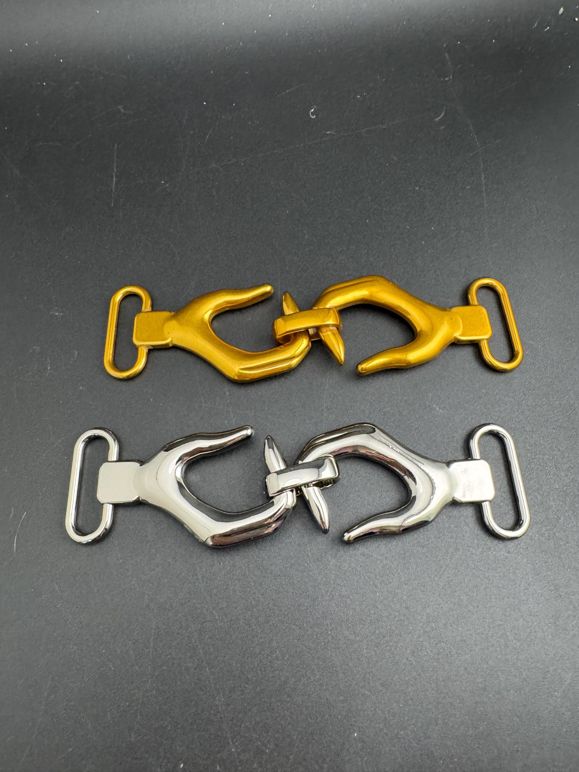 Novelty hand belt buckle, gold and silver tone 13cm