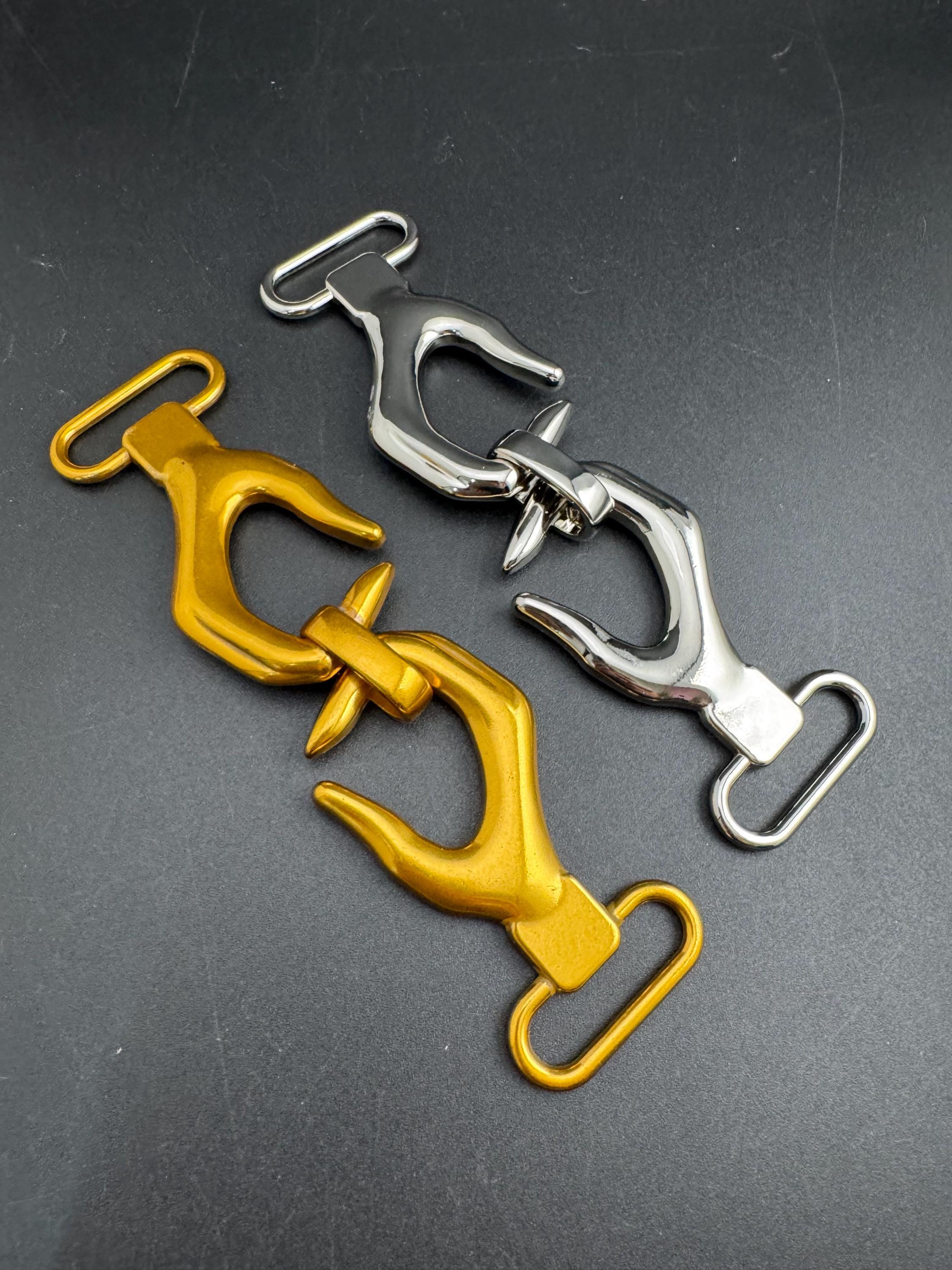 Novelty hand belt buckle, gold and silver tone 13cm