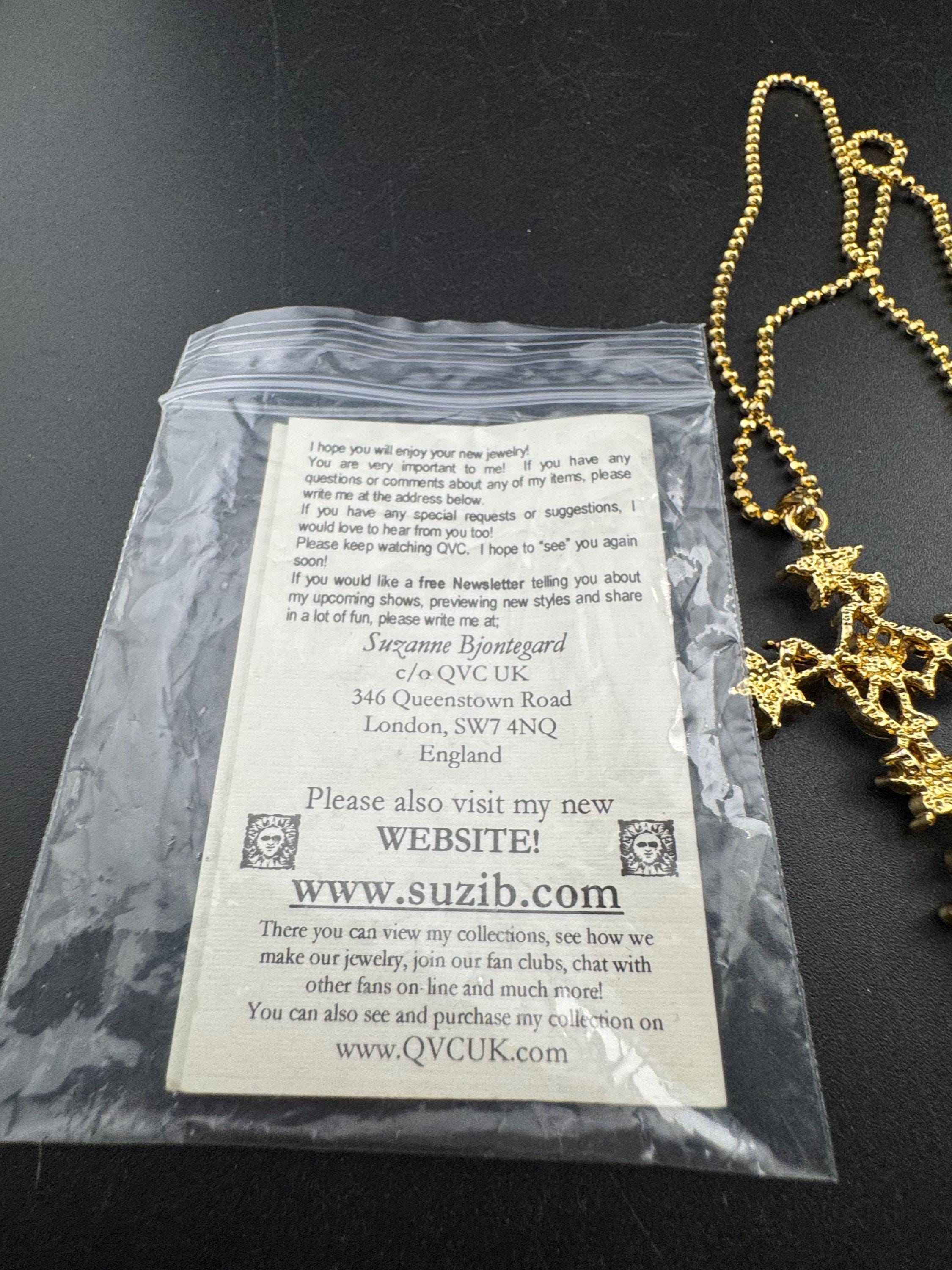 Suzanne Bjontegatd coloured rhinestone cross pendant on gold tone ball chain