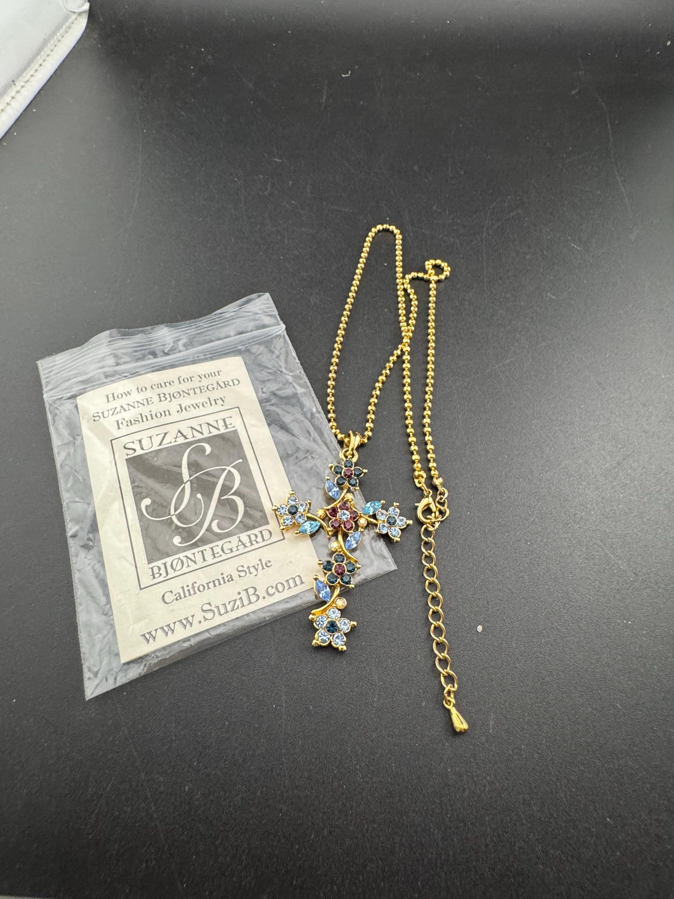 Suzanne Bjontegatd coloured rhinestone cross pendant on gold tone ball chain