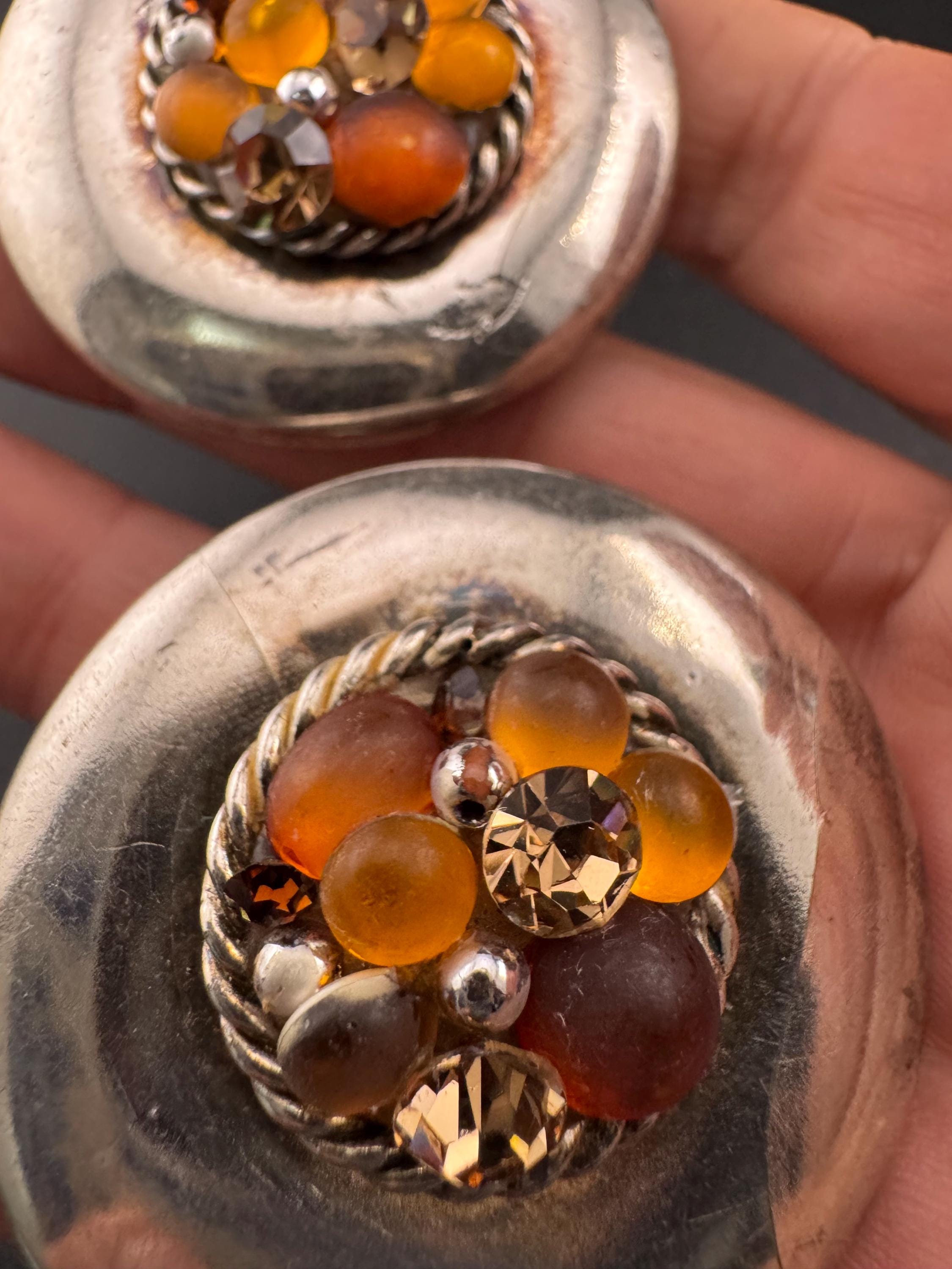 Jacky de G Oversized silver domed Clip On Earrings: designer orange stones