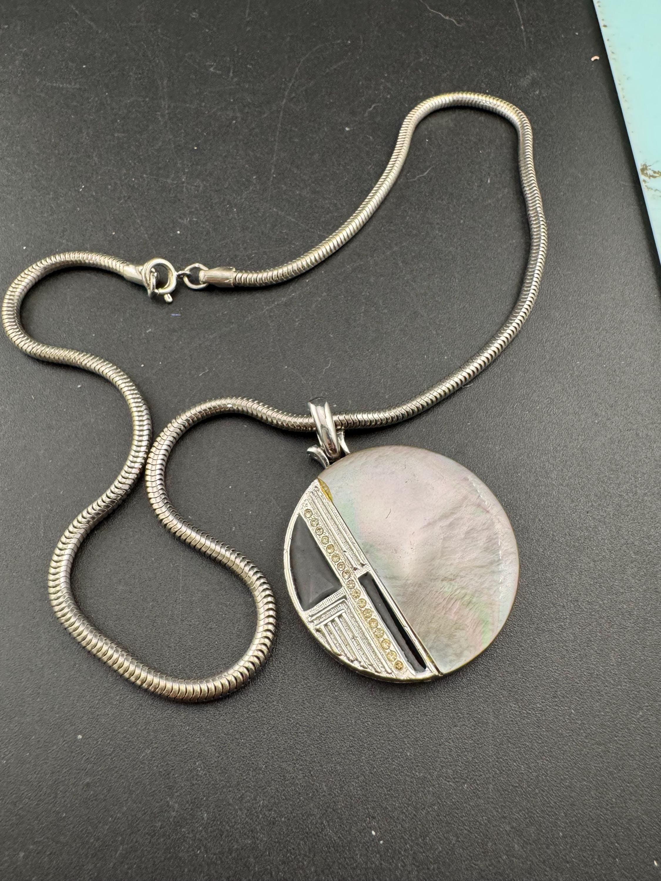 Signed MANDLE black enamel mother of pearl disc pendant on a snake chain necklace