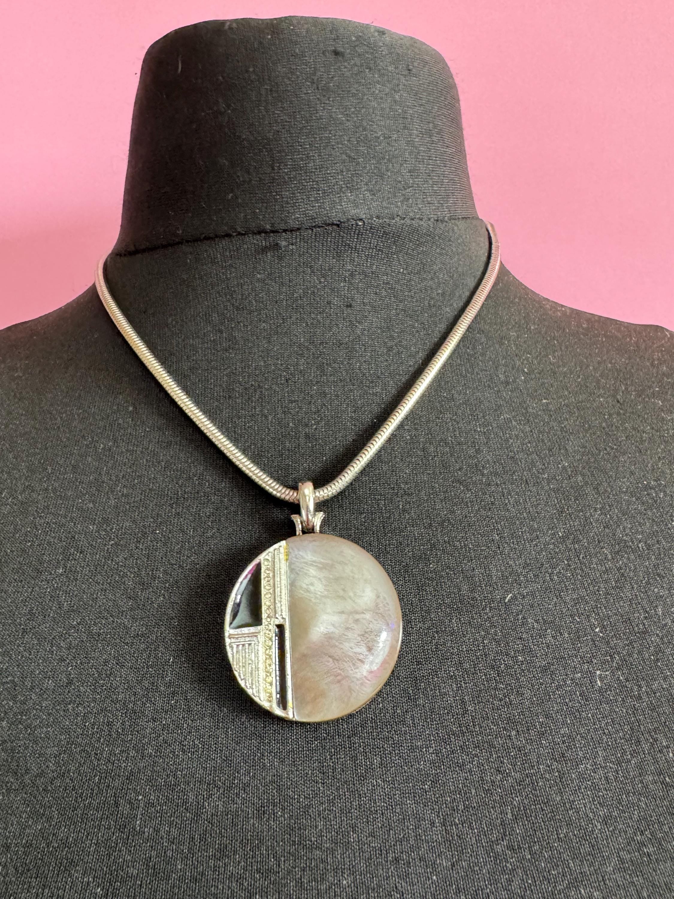 Signed MANDLE black enamel mother of pearl disc pendant on a snake chain necklace
