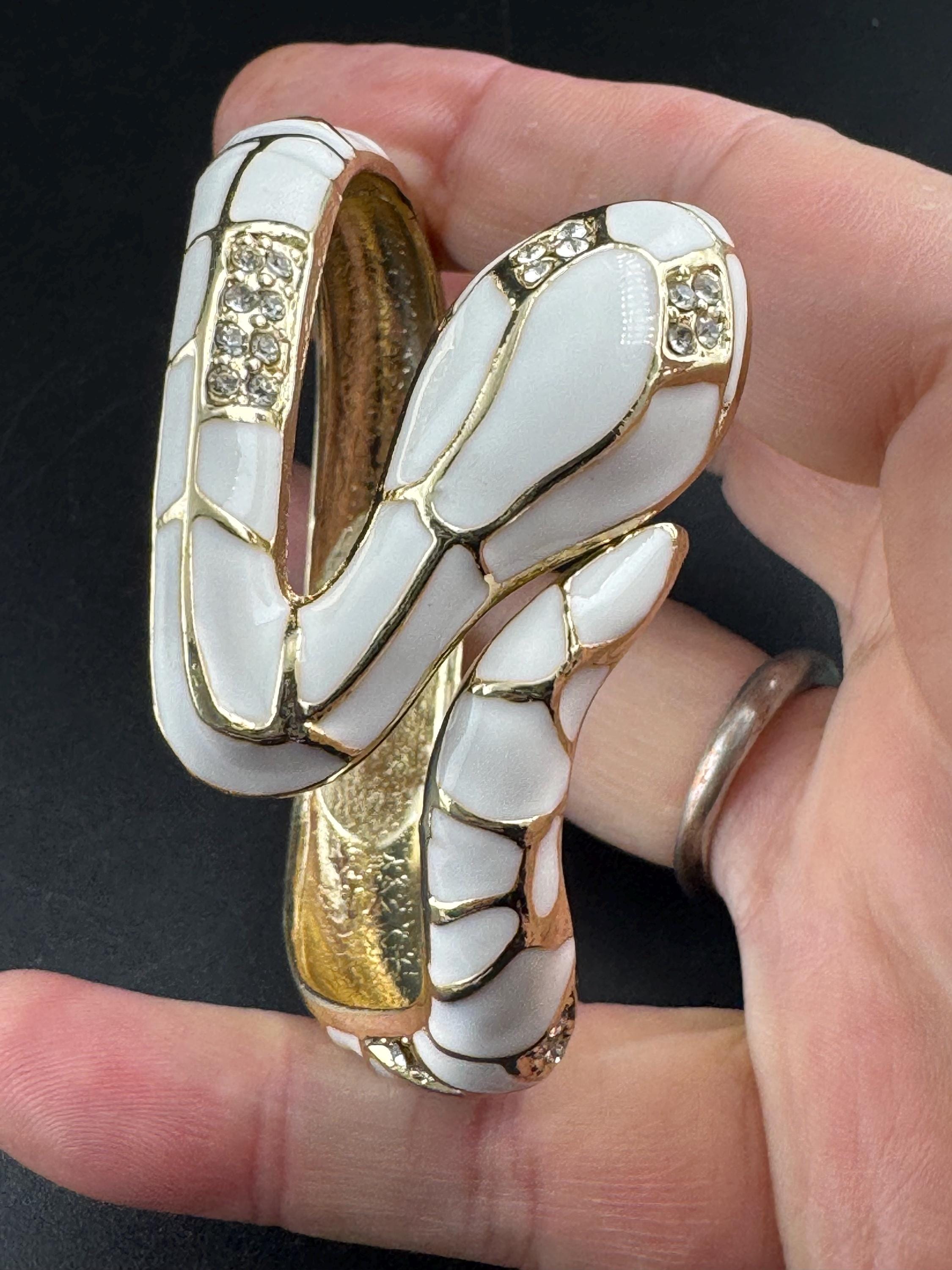 White enamel diamanté hinged snake bangle, clear rhinestone eyes gold tone