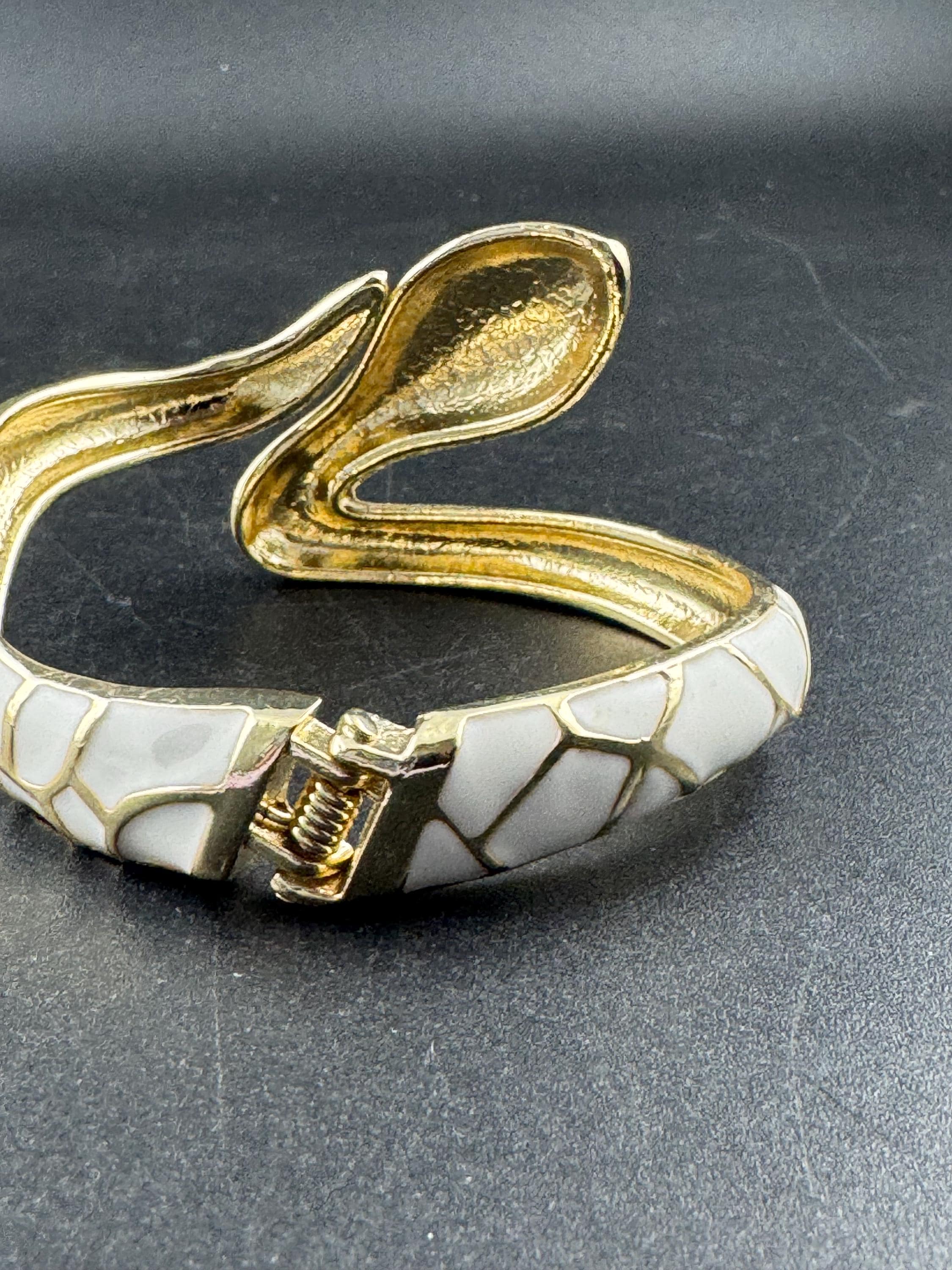 White enamel diamanté hinged snake bangle, clear rhinestone eyes gold tone