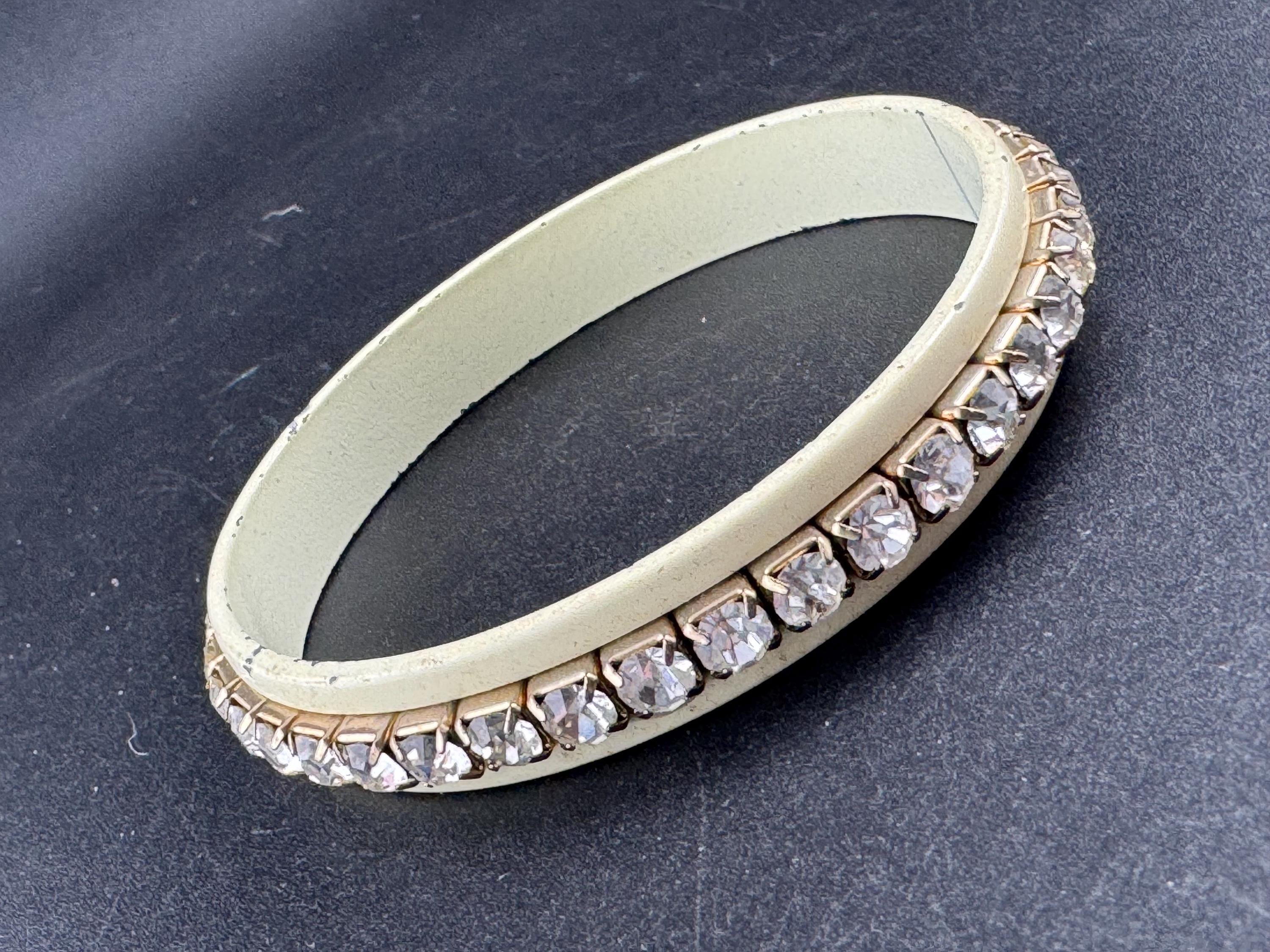 1960s cream enamel and clear diamanté fixed, slim bangle bracelet with wear