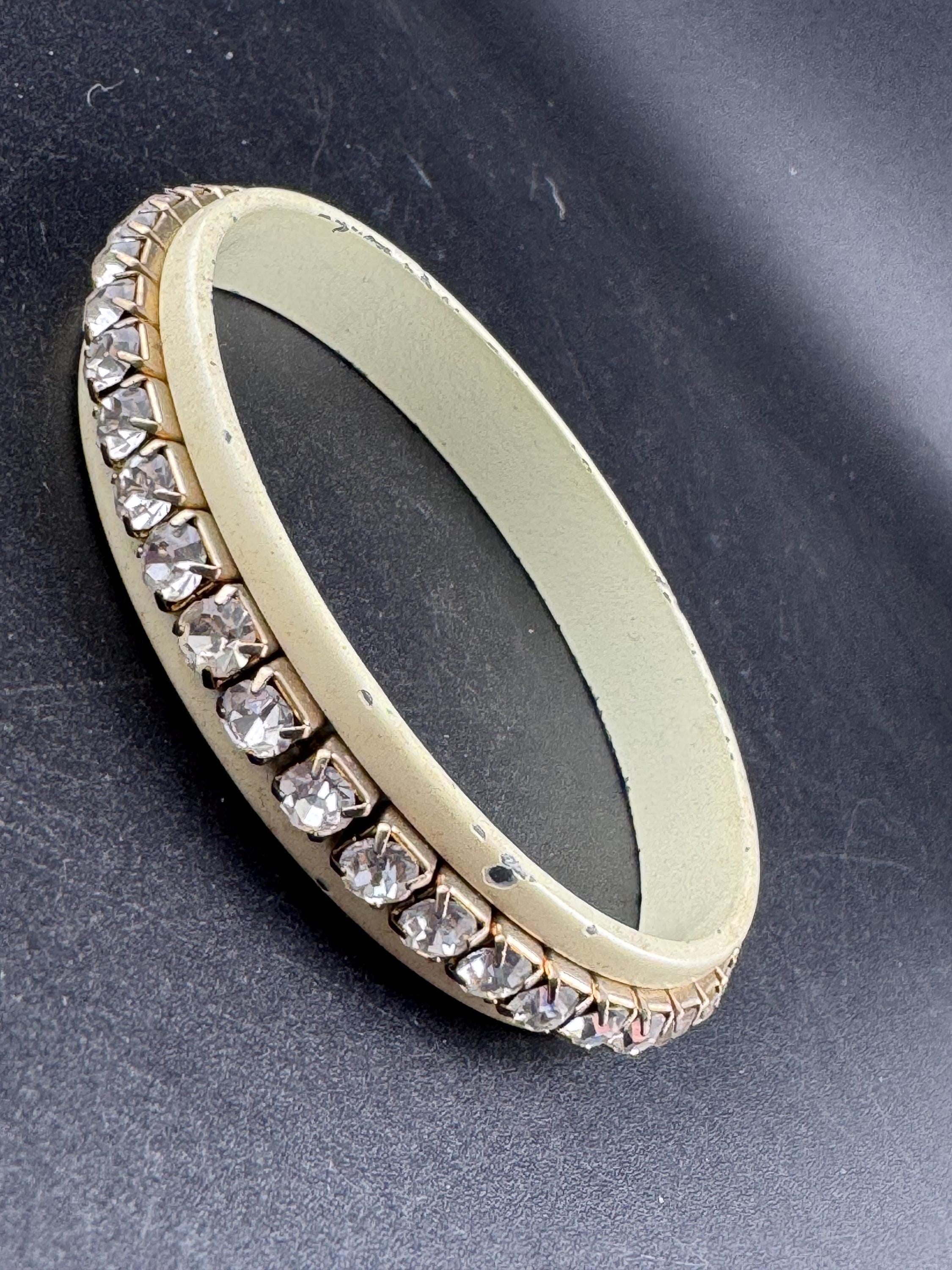 1960s cream enamel and clear diamanté fixed, slim bangle bracelet with wear