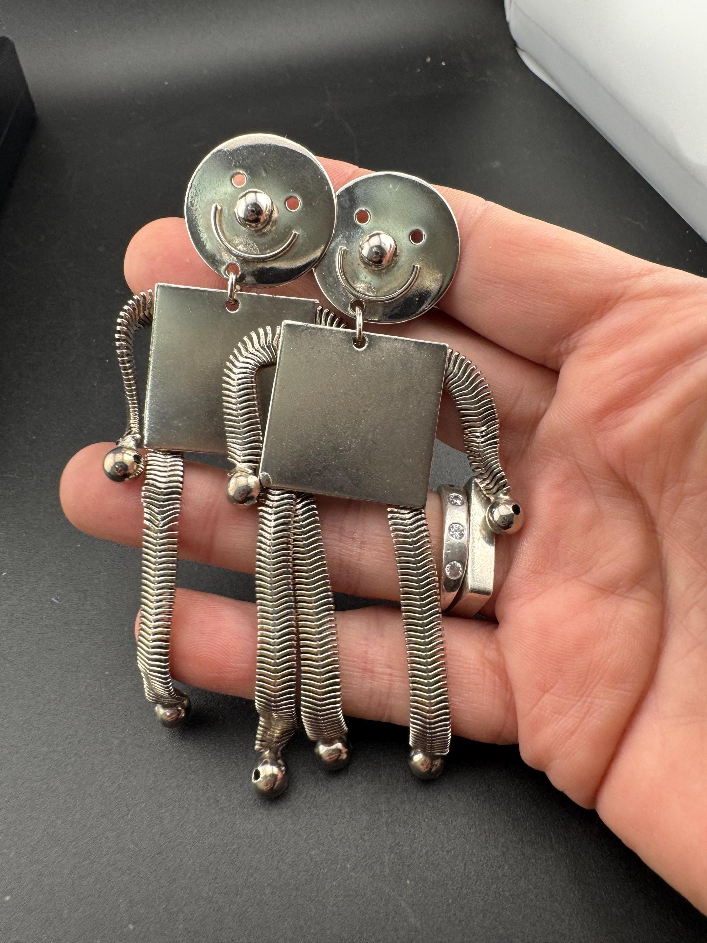 vintage robot clip on earrings , silver tone articulated and oversized