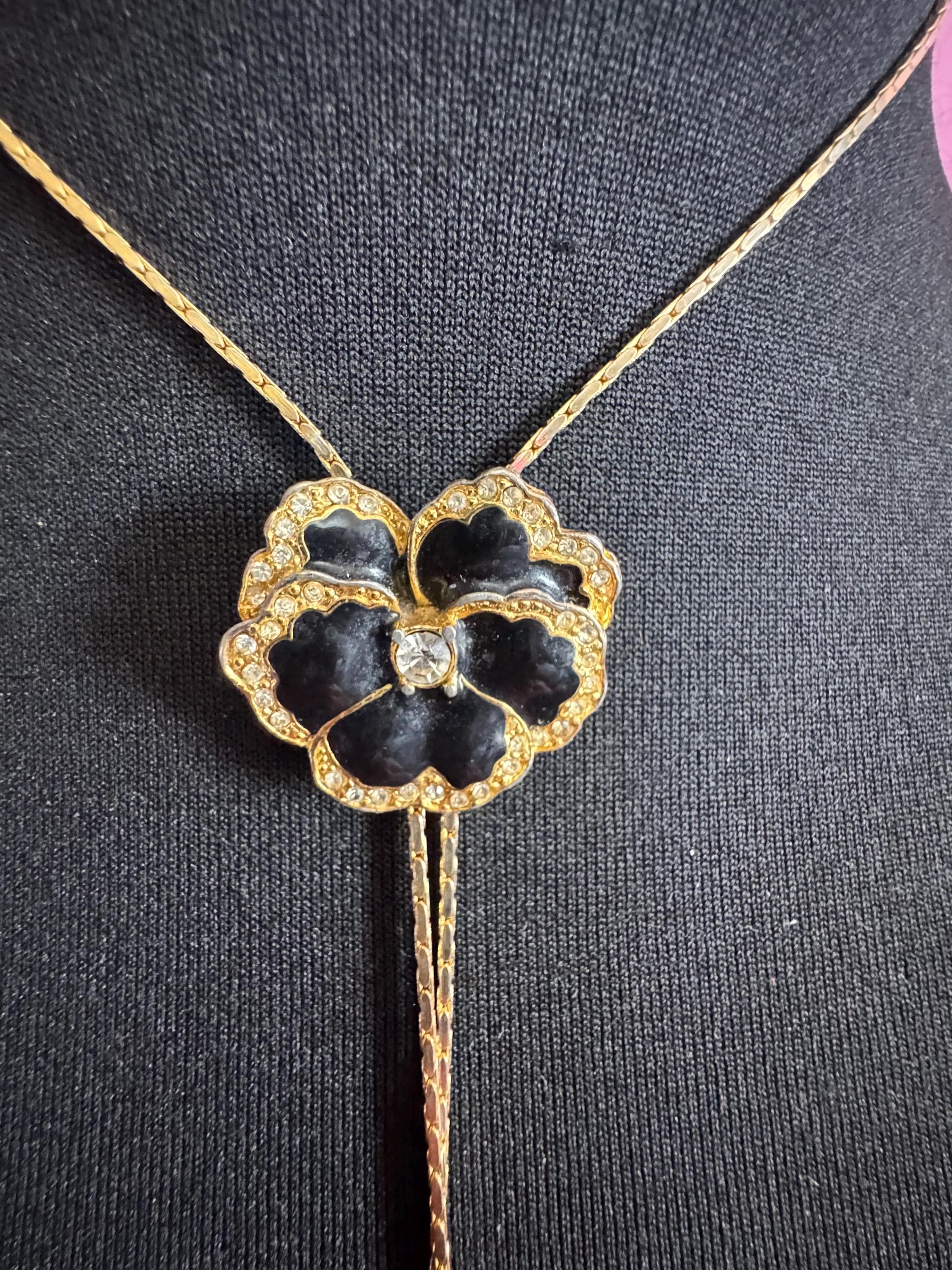 Vintage black enamel and crystal floral slider bolo necklace, with pat no , gold plated