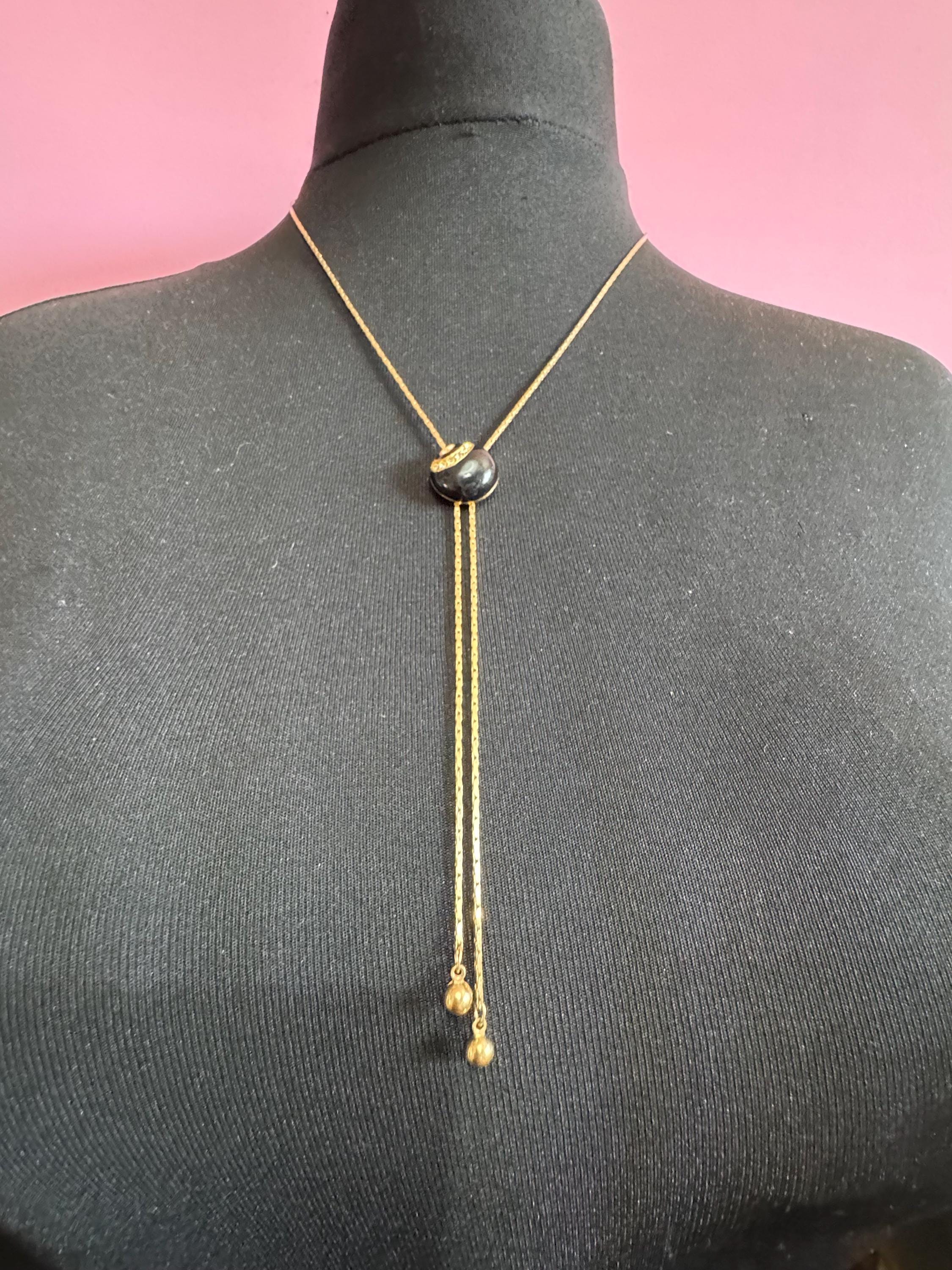 Vintage black enamel and crystal slider bolo necklace, with pat no , gold plated