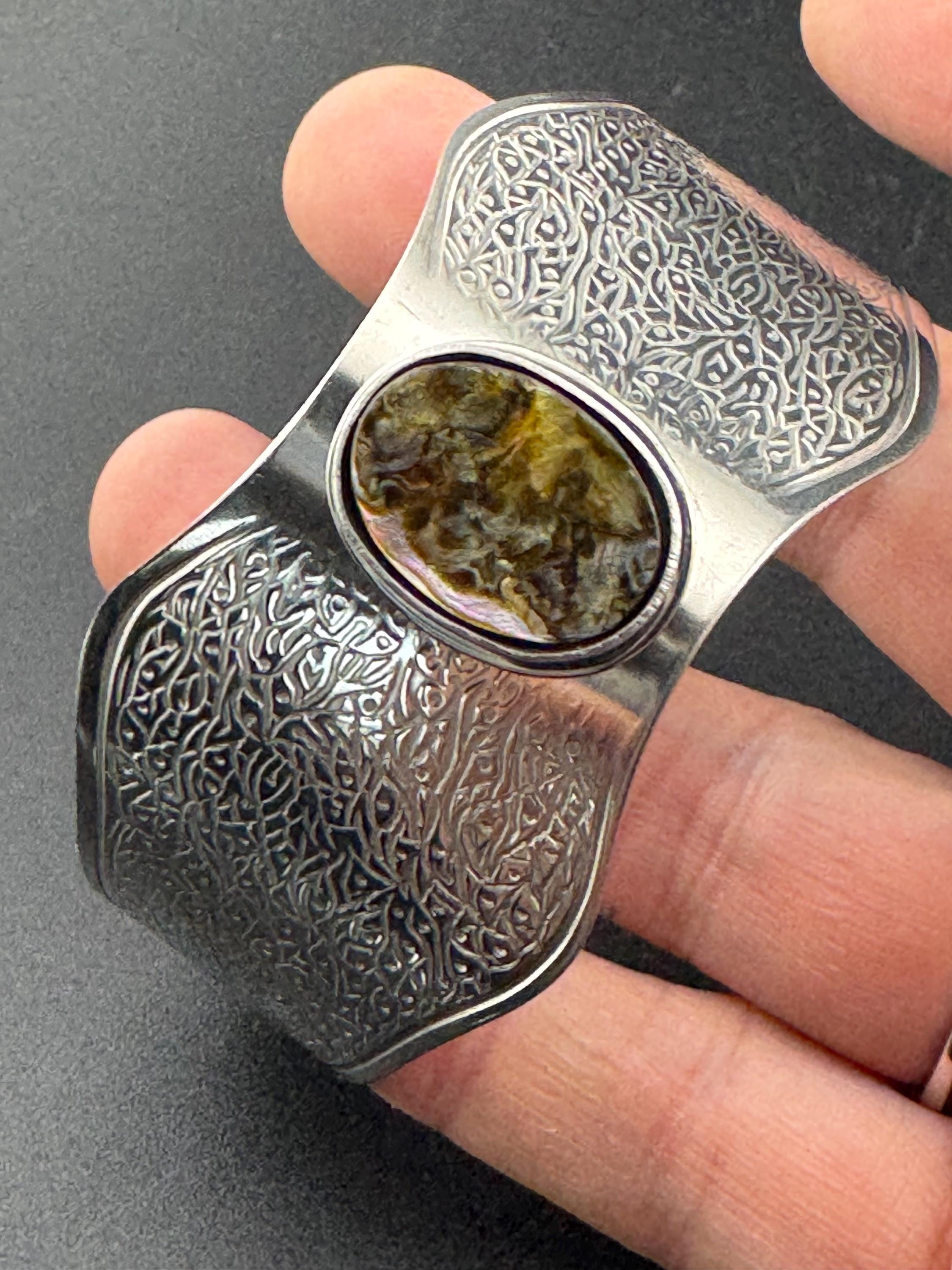 1970s stainless steel wide bangle , Jason designs with central abalone shell cabochon