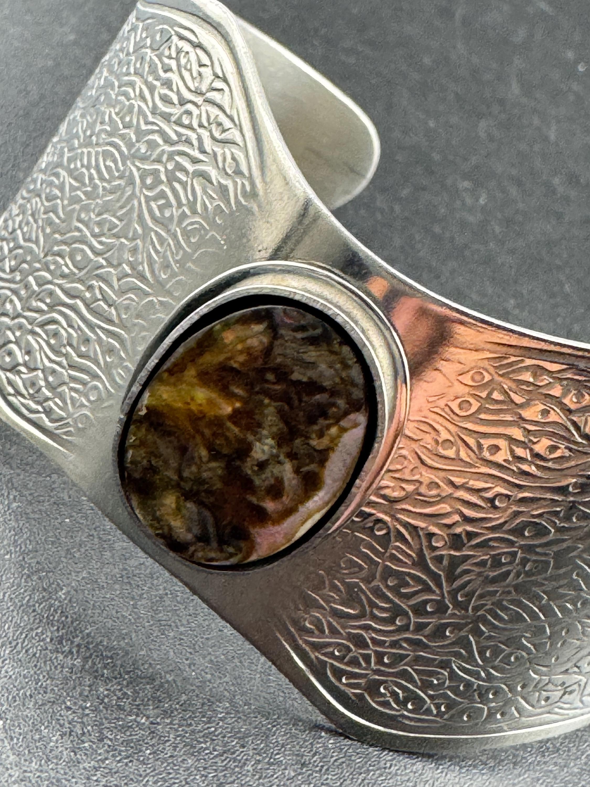1970s stainless steel wide bangle , Jason designs with central abalone shell cabochon