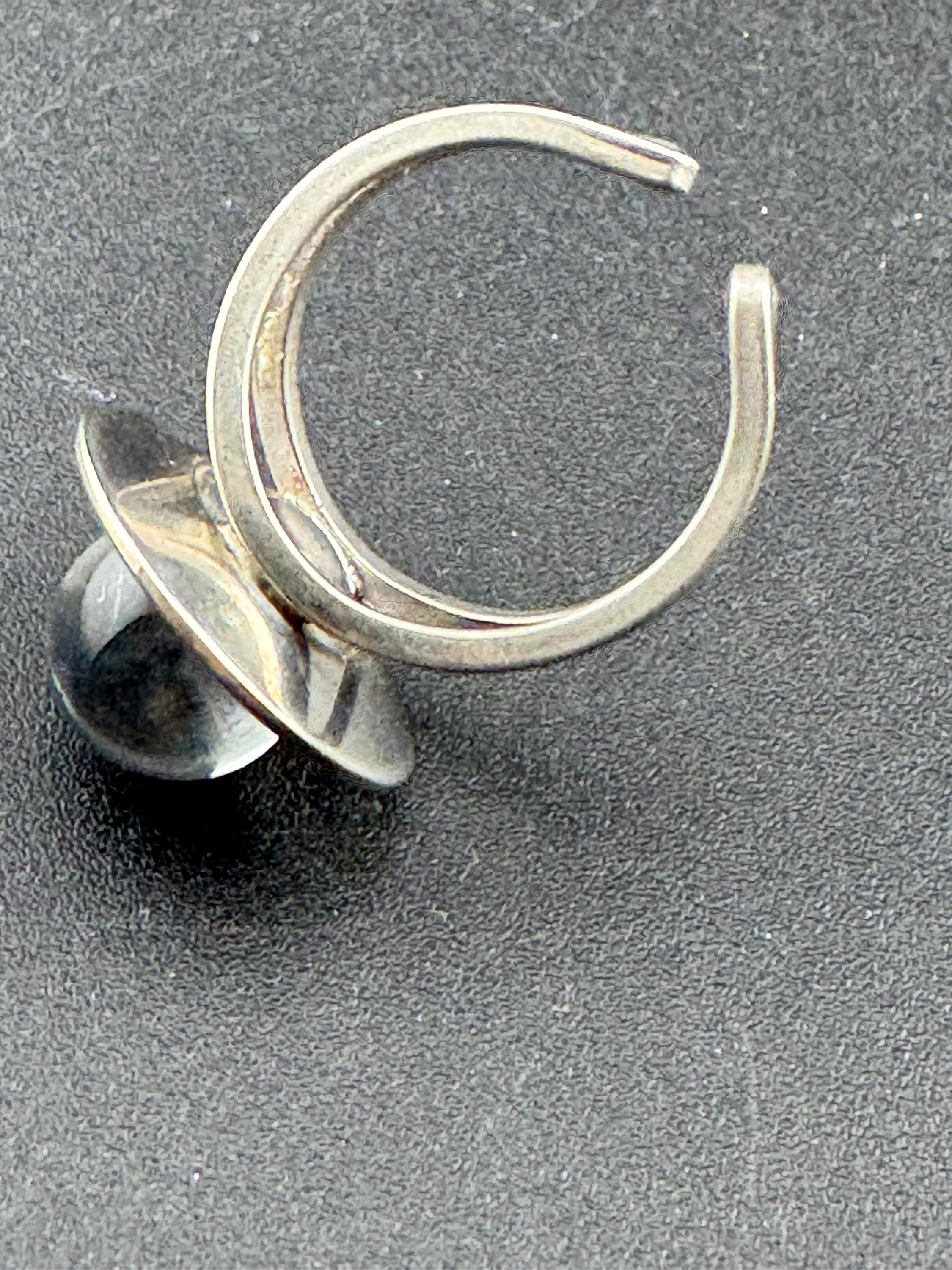 1970s stainless steel adjustable ring, set with blue glass ball cabochon