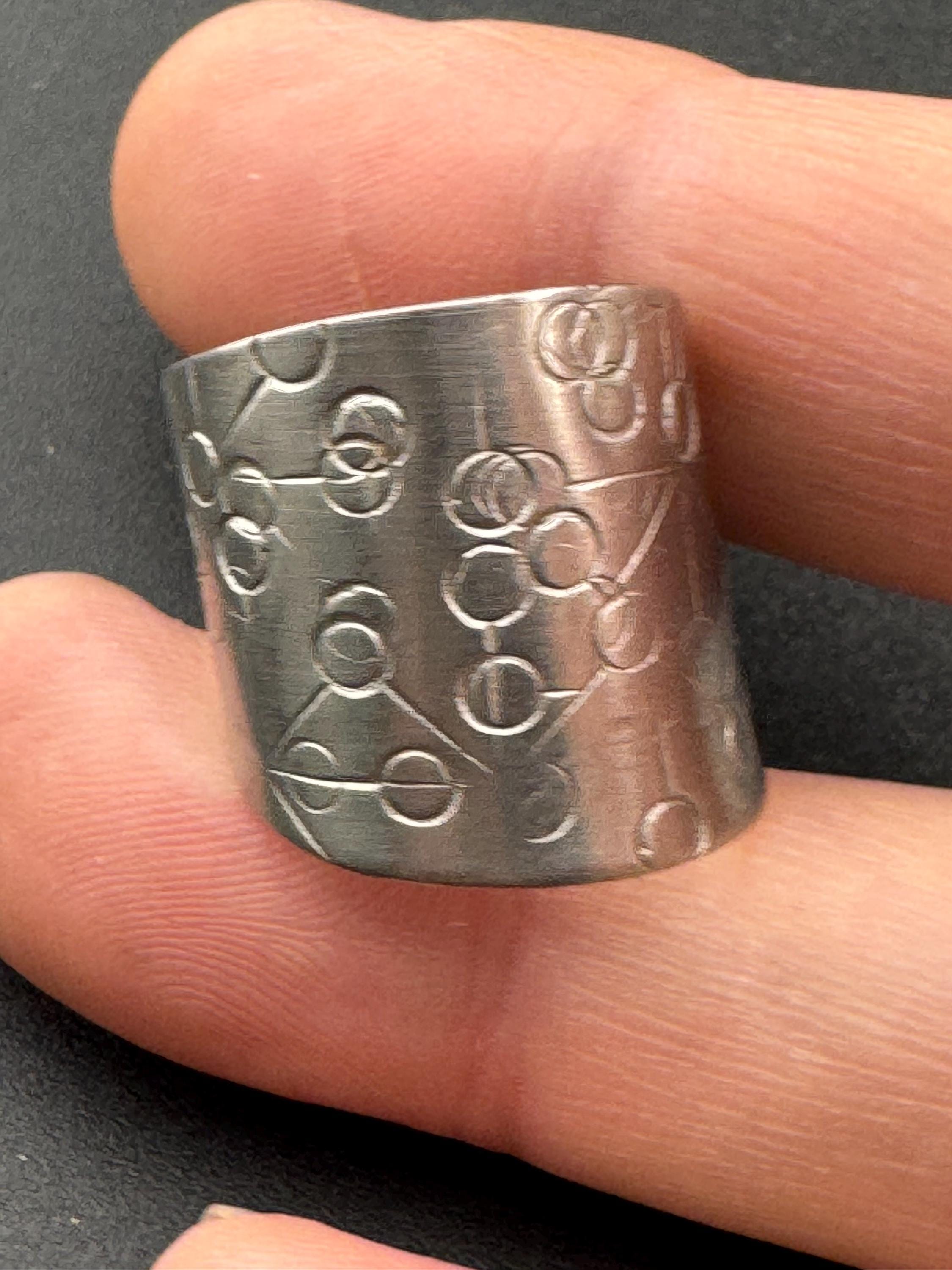 1970s stainless steel adjustable ring, with futuristic etch pattern