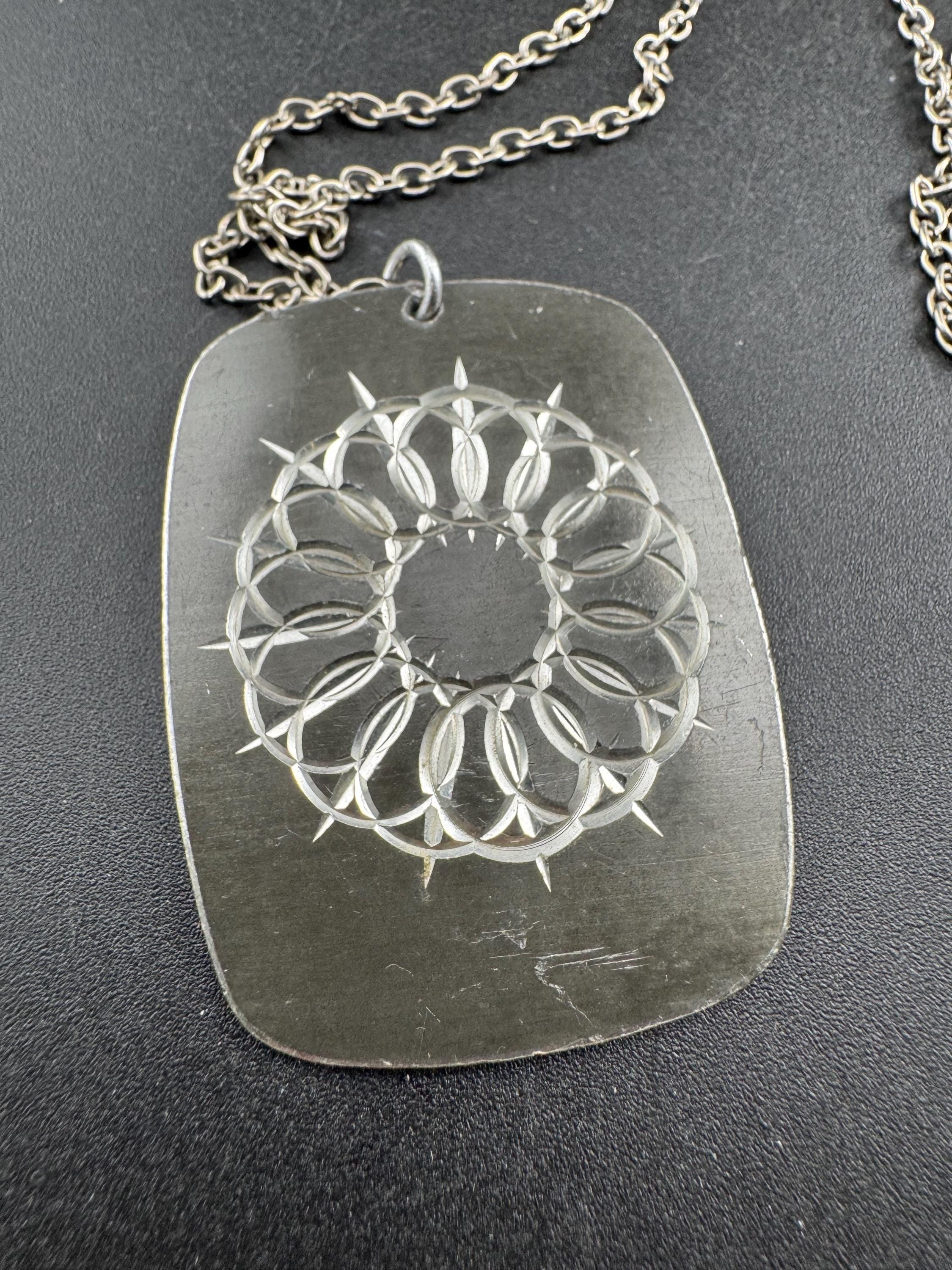 Vintage 1970s stainless steel etched pendant on a 68cm chain