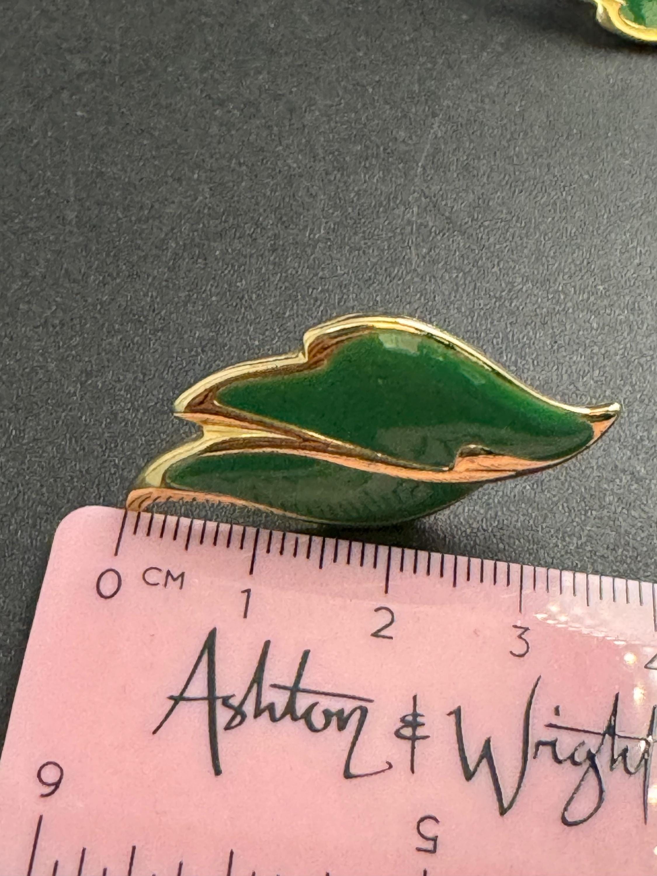 green enamel leaf clip on earrings, signed L gold tone