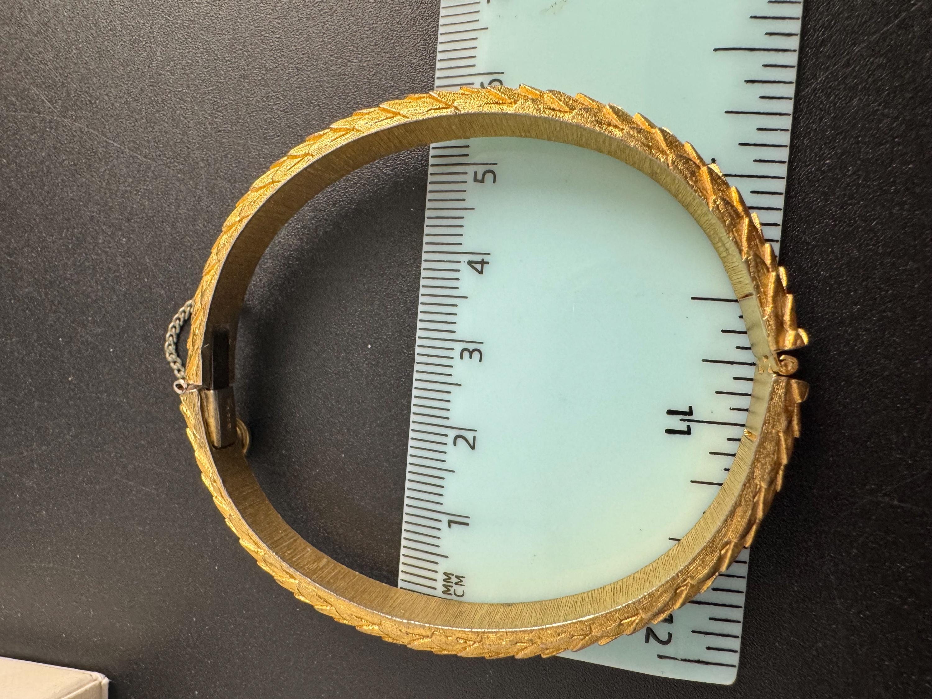 Crown Trifari gold-tone hinged bangle bracelet, textured snake or fish scale pattern