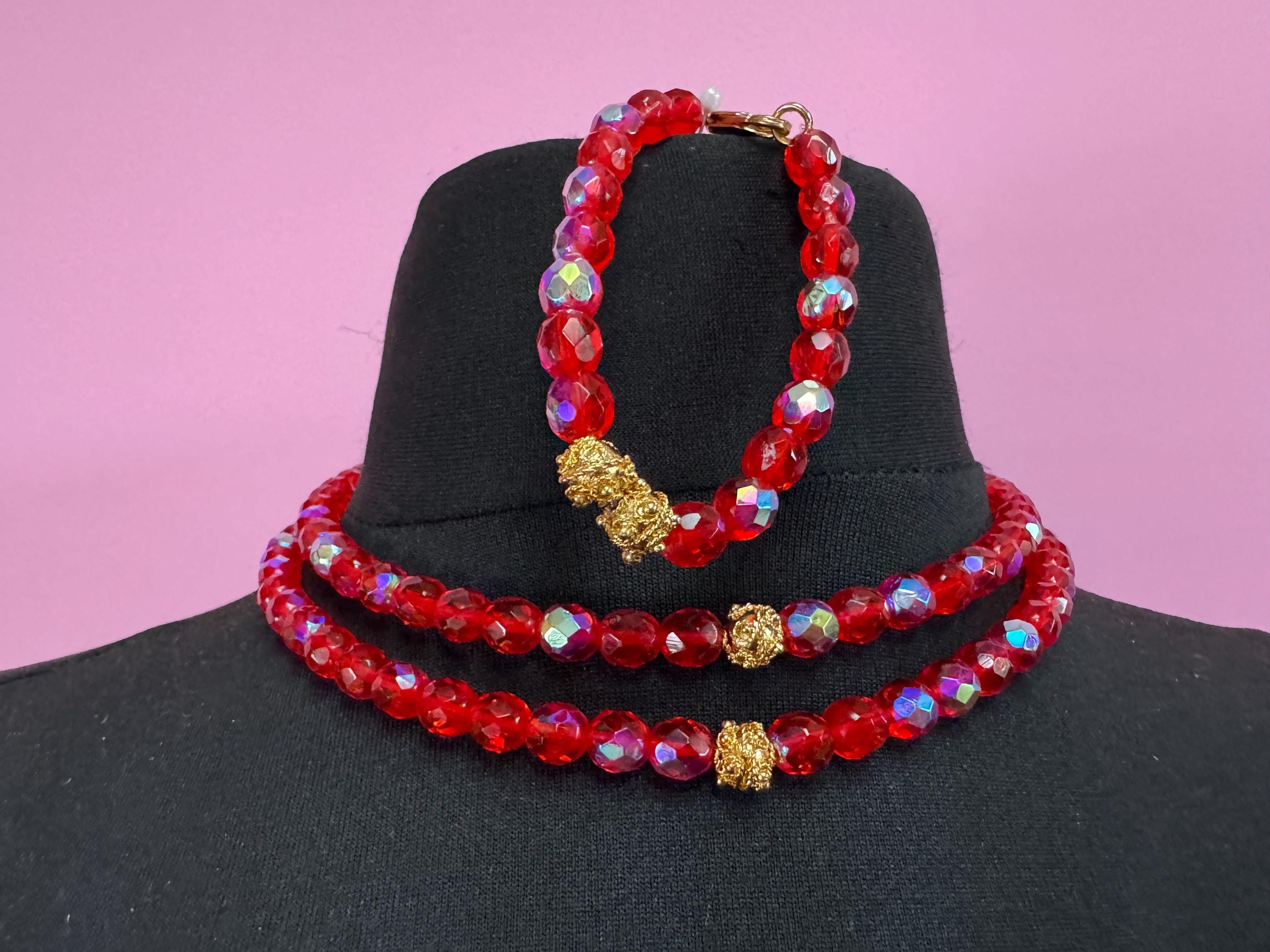 Red glass beaded crystal Multistrand necklace and matching bracelet, faceted beads gold tone