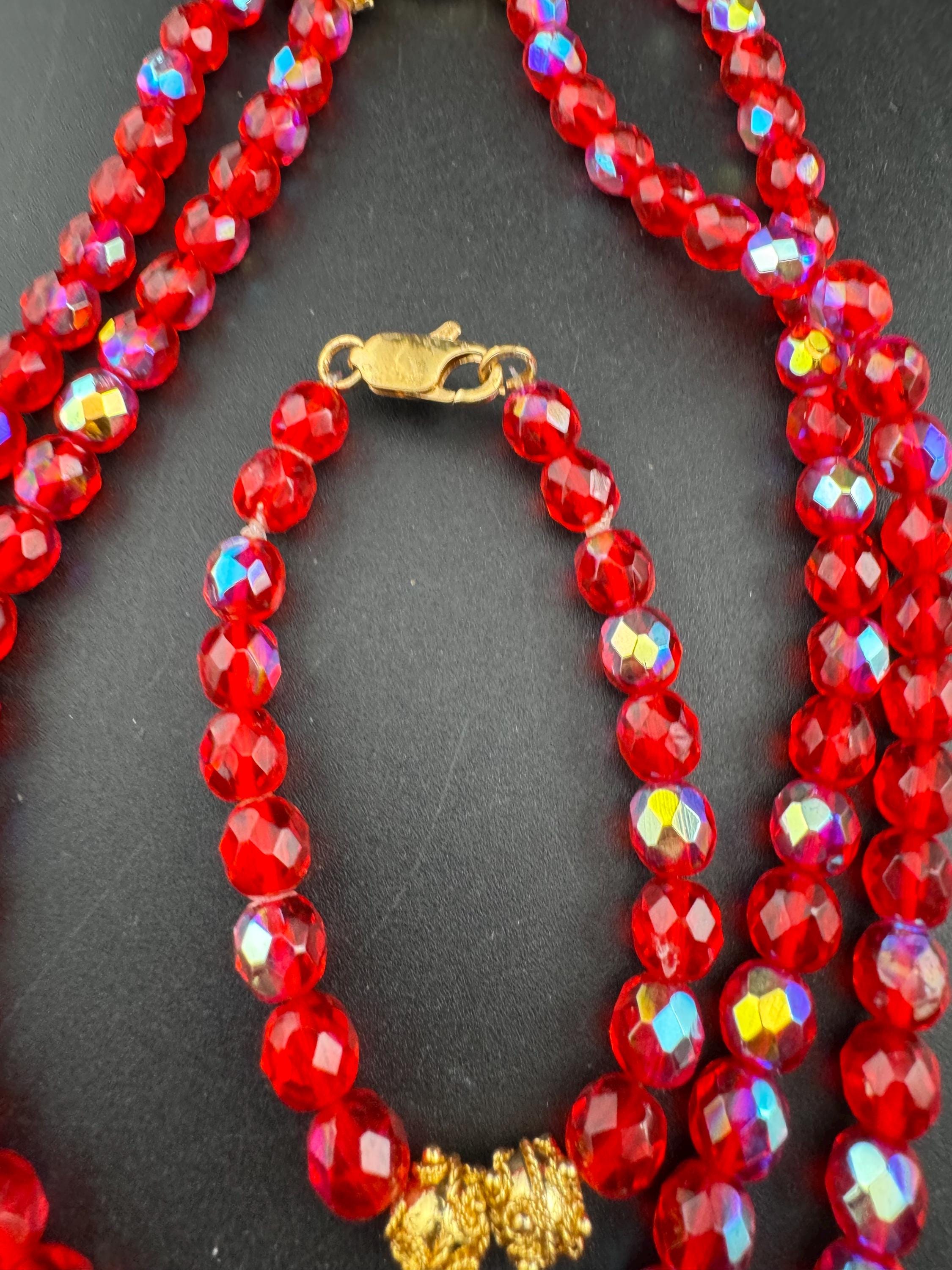 Red glass beaded crystal Multistrand necklace and matching bracelet, faceted beads gold tone