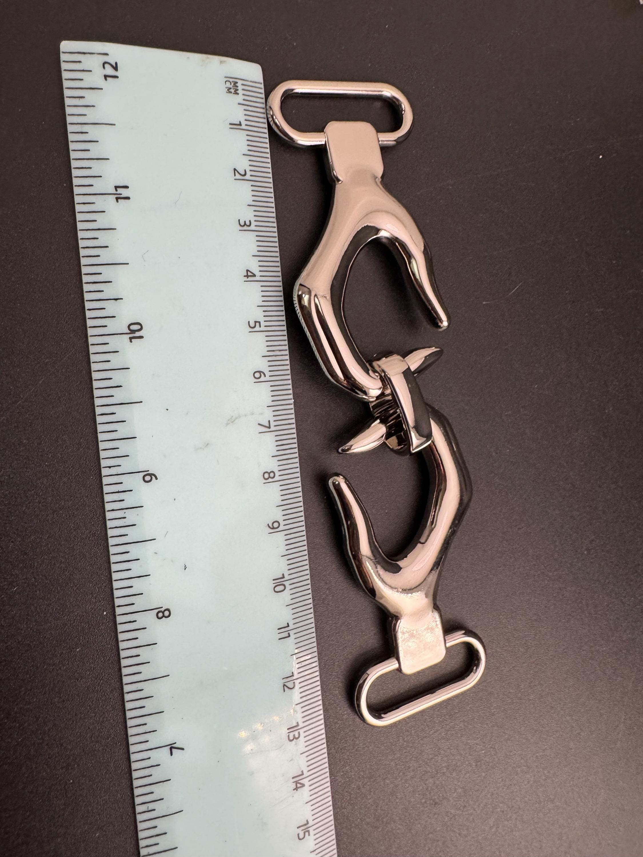 Novelty hand belt buckle, gold and silver tone 13cm