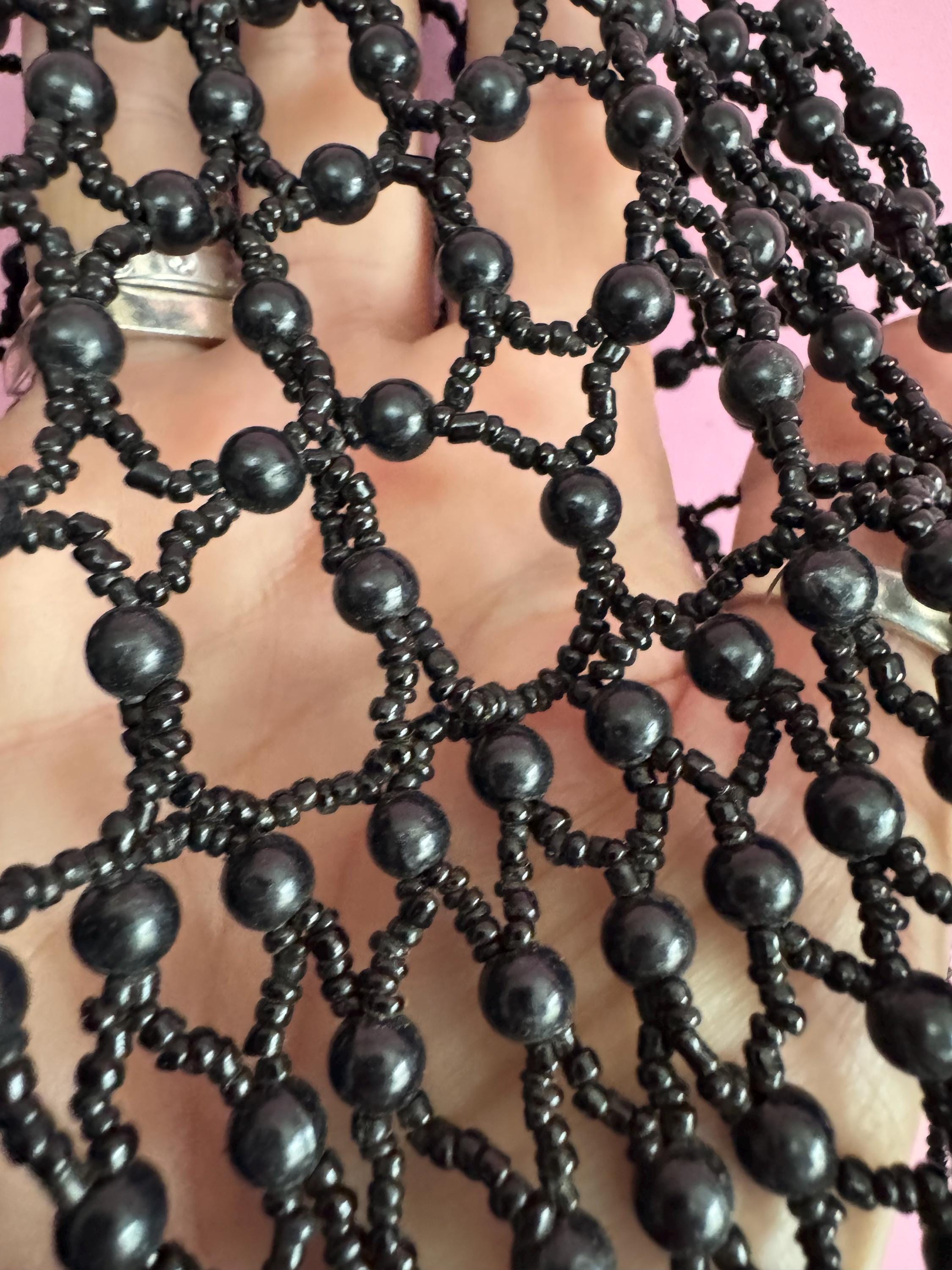 Quirky black head piece bead cloche headress