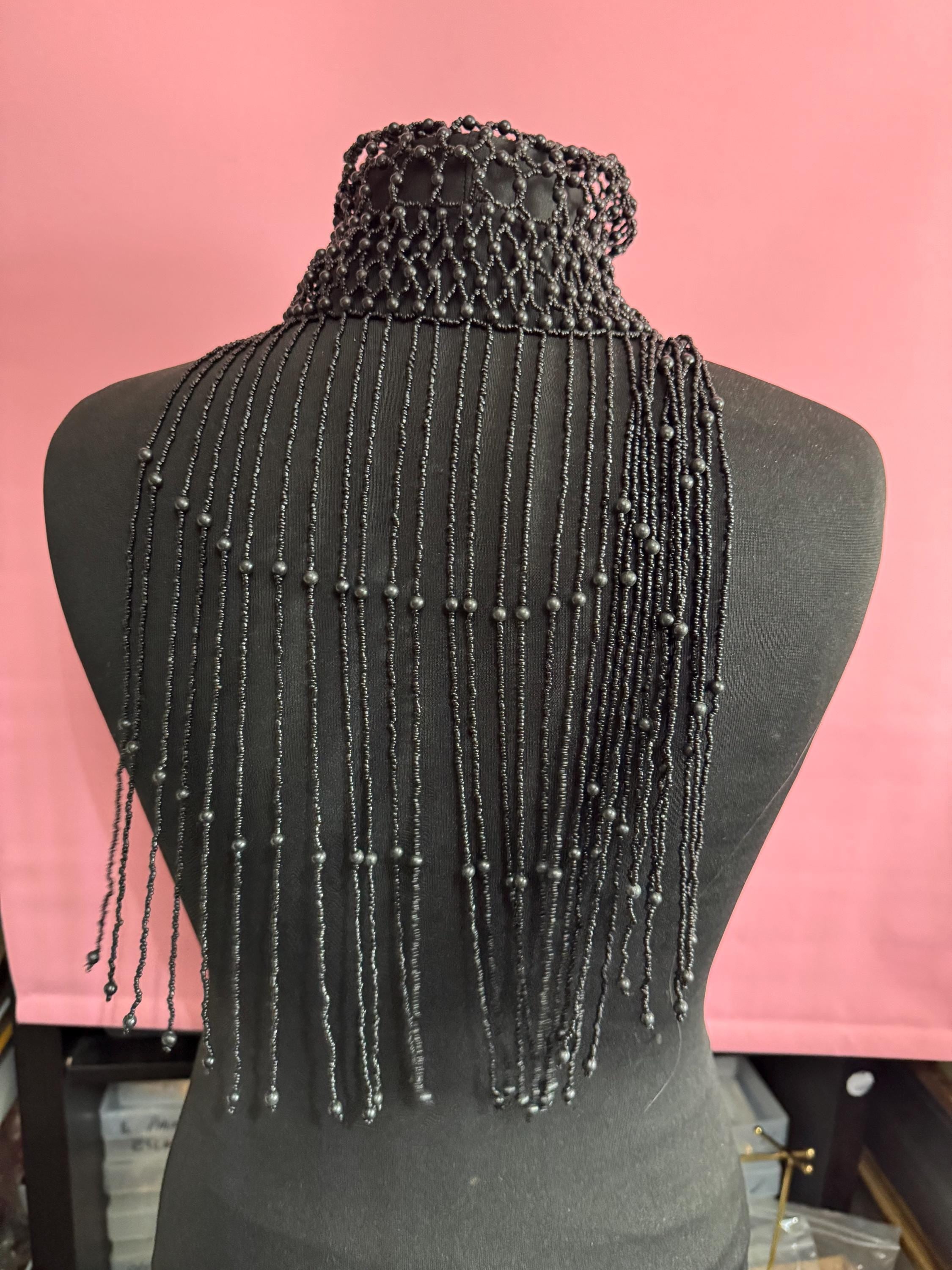 Quirky black head piece bead cloche headress