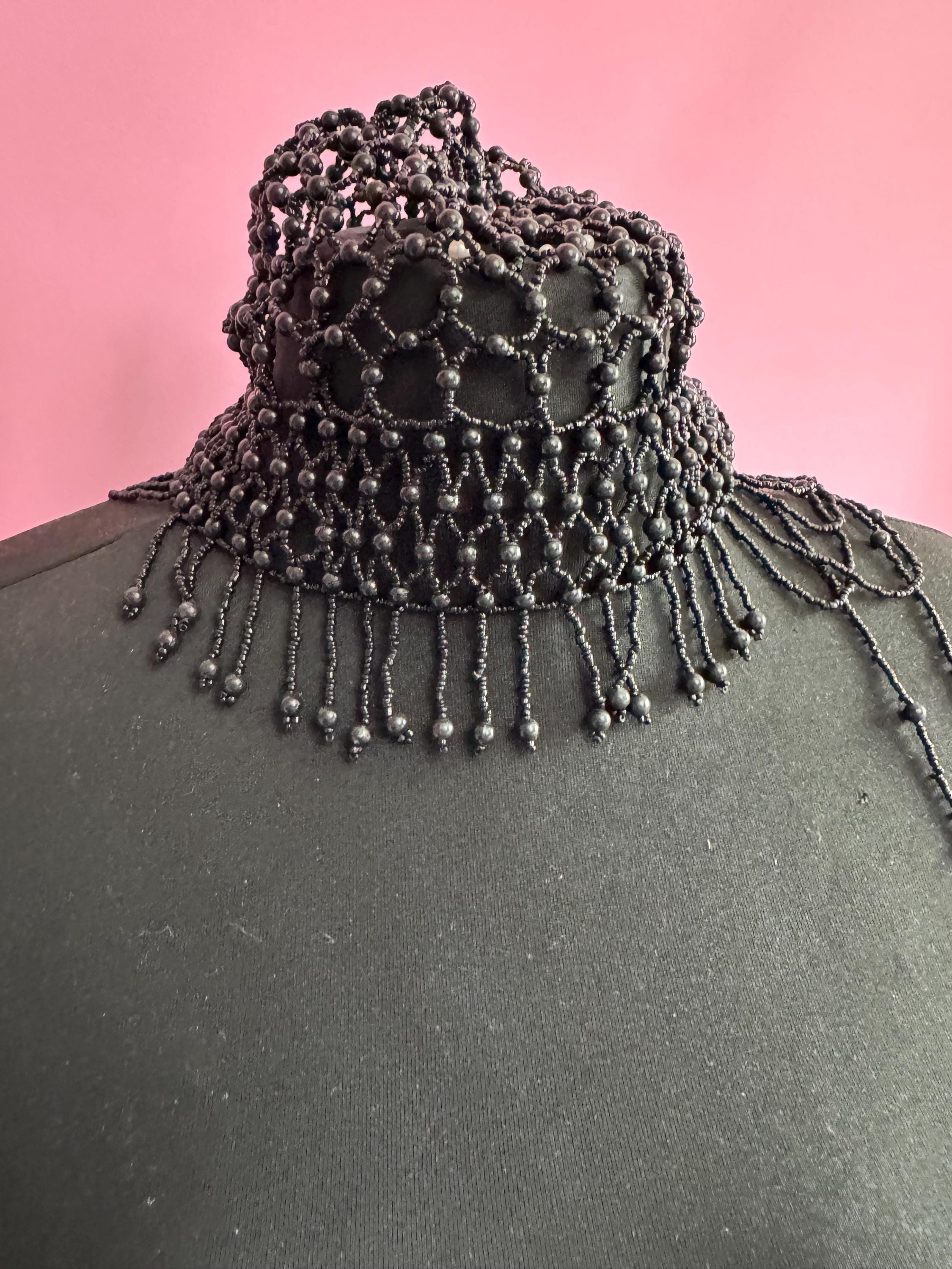 Quirky black head piece bead cloche headress