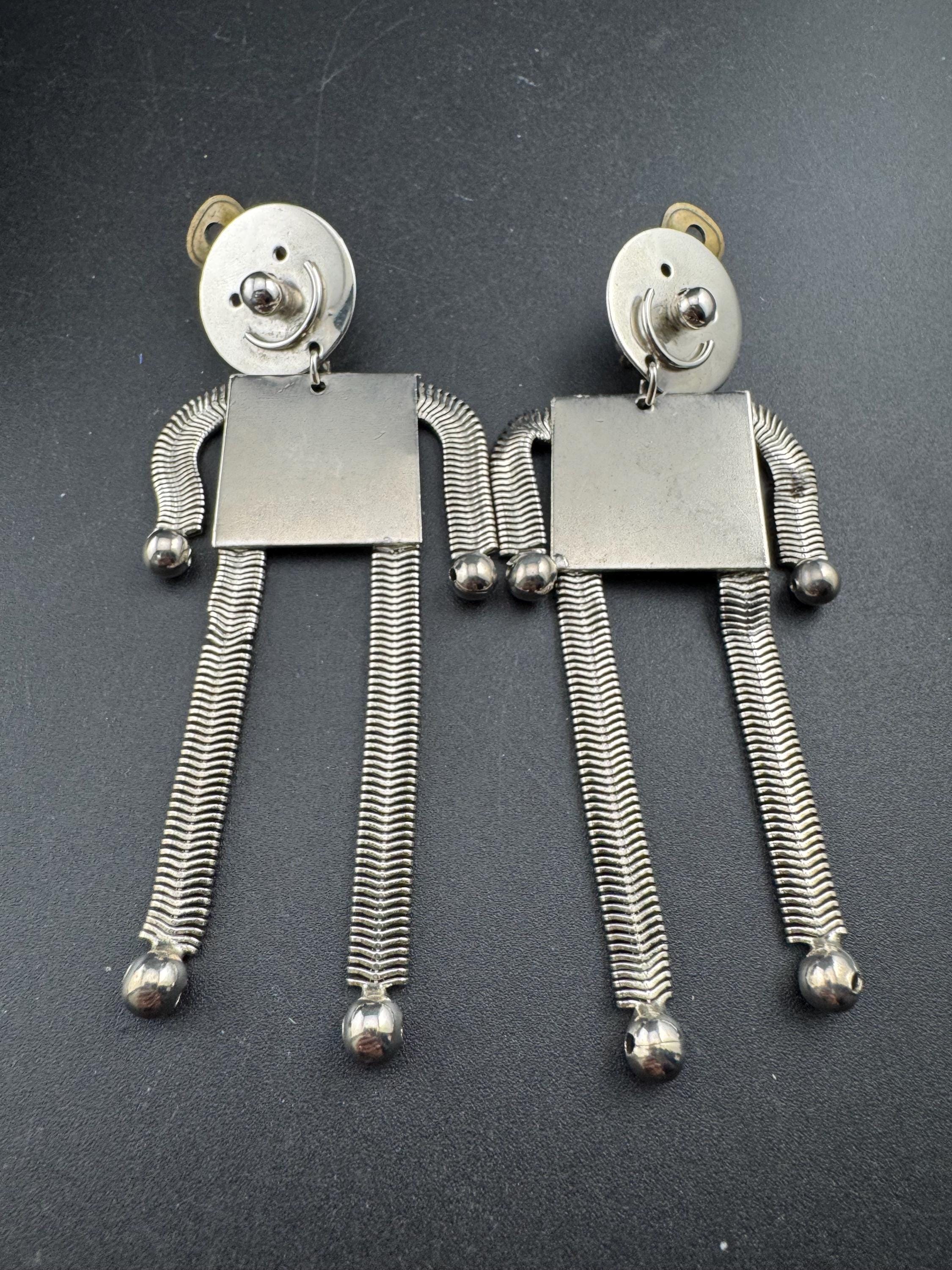 vintage robot clip on earrings , silver tone articulated and oversized