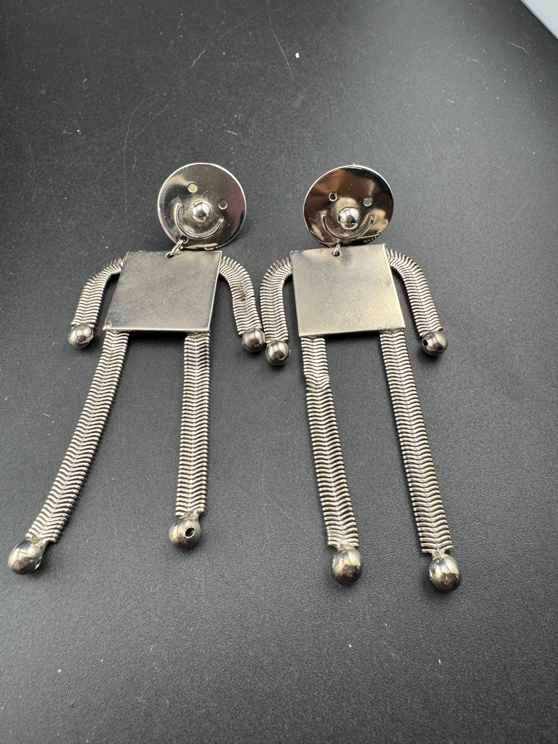 vintage robot clip on earrings , silver tone articulated and oversized