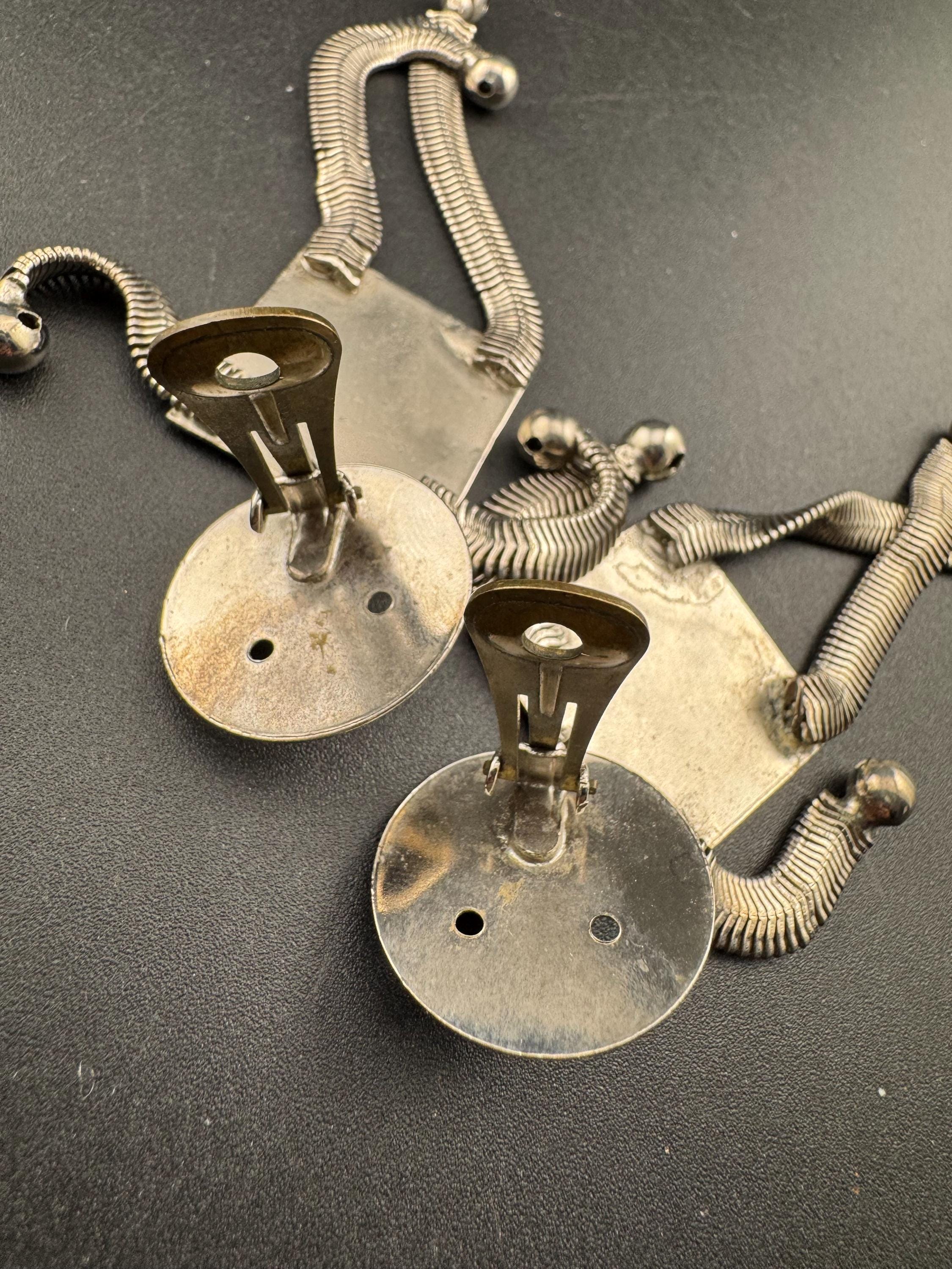 vintage robot clip on earrings , silver tone articulated and oversized