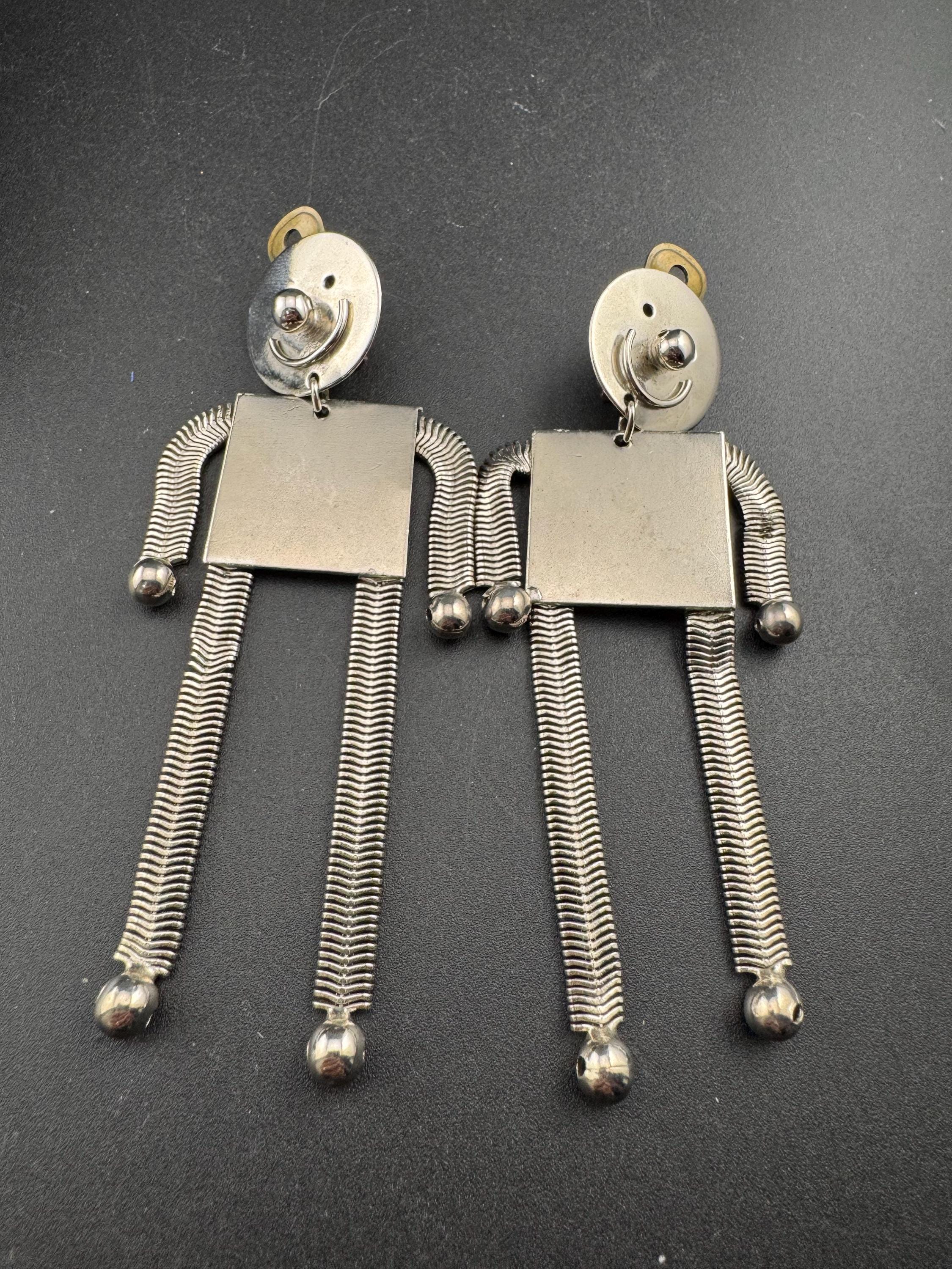 vintage robot clip on earrings , silver tone articulated and oversized