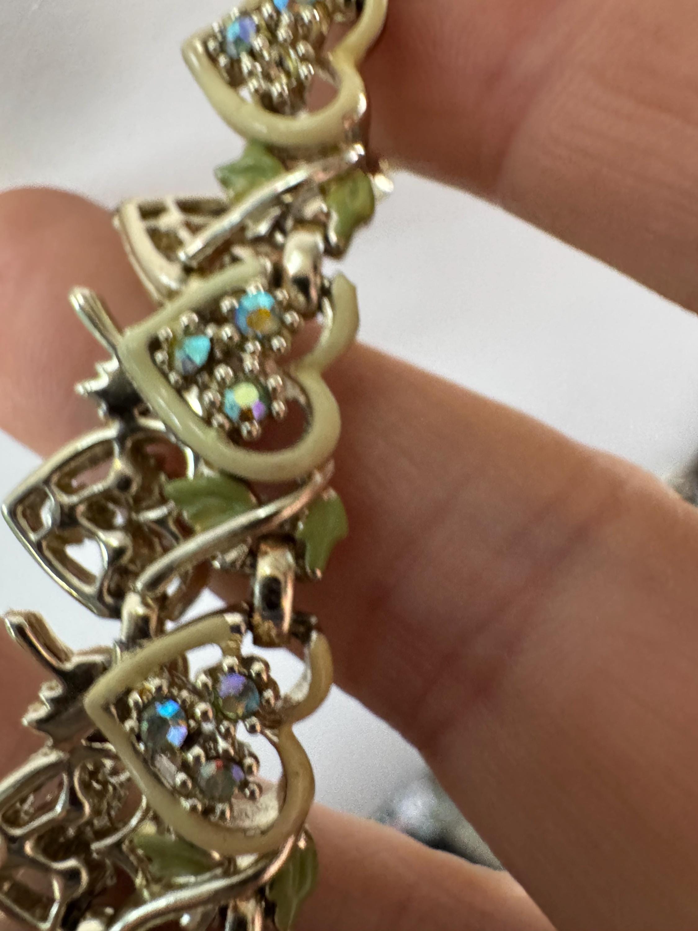 Vintage Aurora borealis and cream enamel heart necklace, light gold tone with rhinestone