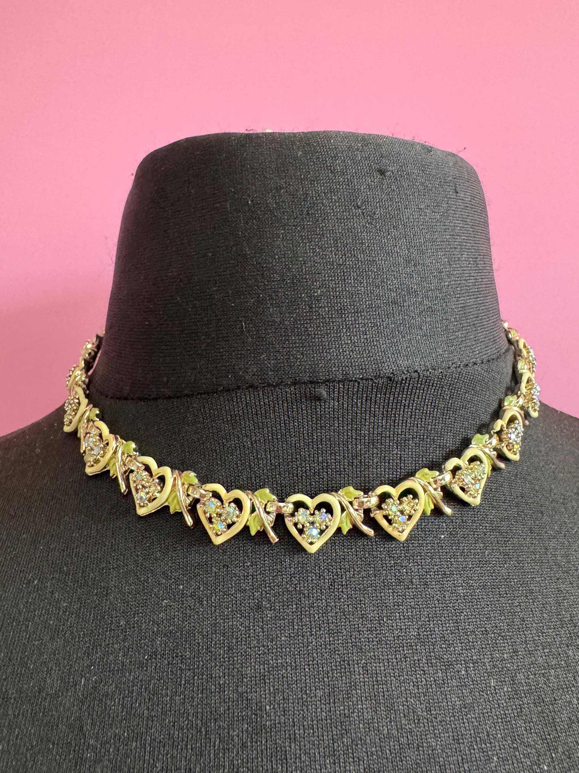 Vintage Aurora borealis and cream enamel heart necklace, light gold tone with rhinestone