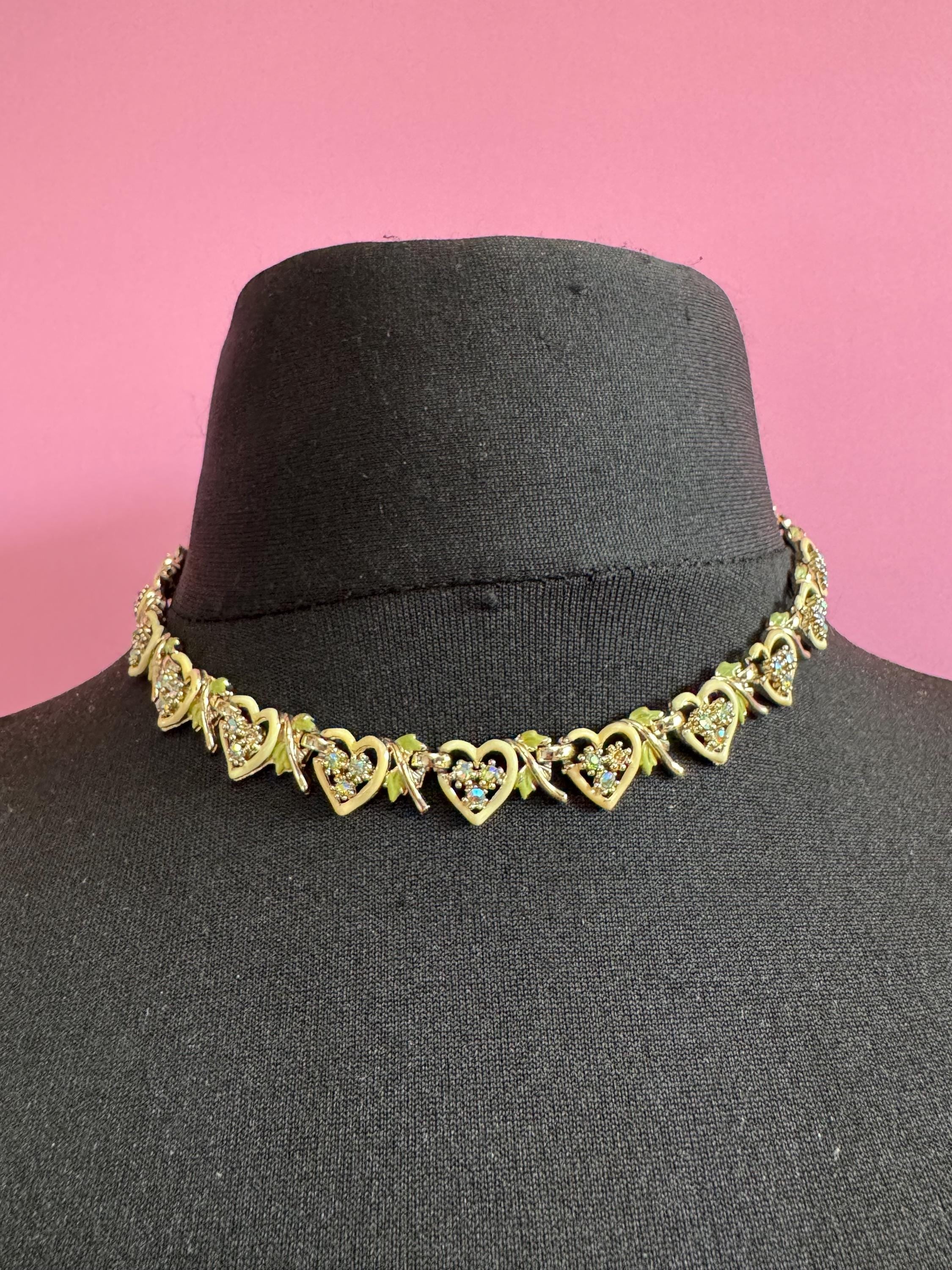 Vintage Aurora borealis and cream enamel heart necklace, light gold tone with rhinestone