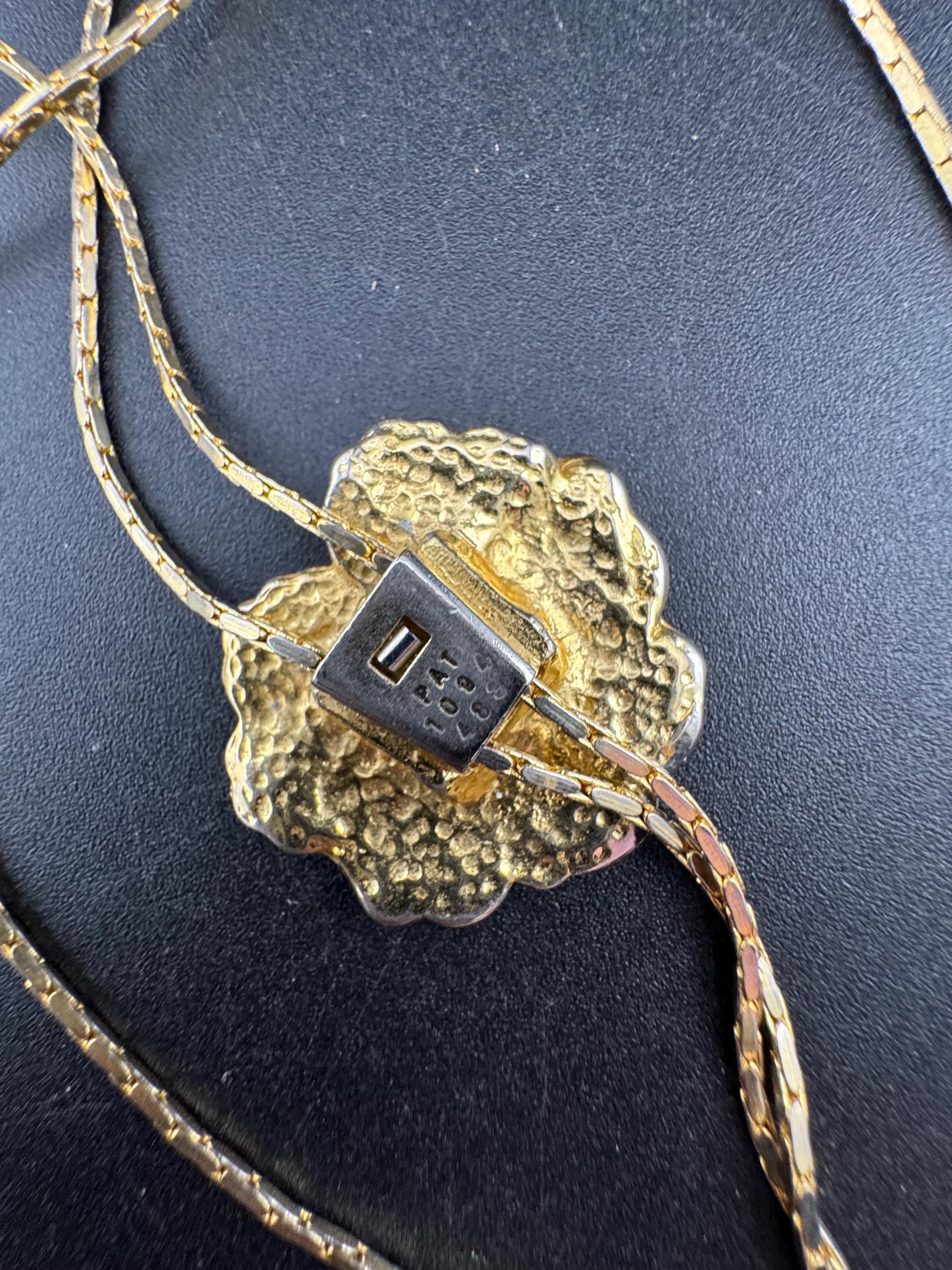 Vintage black enamel and crystal floral slider bolo necklace, with pat no , gold plated