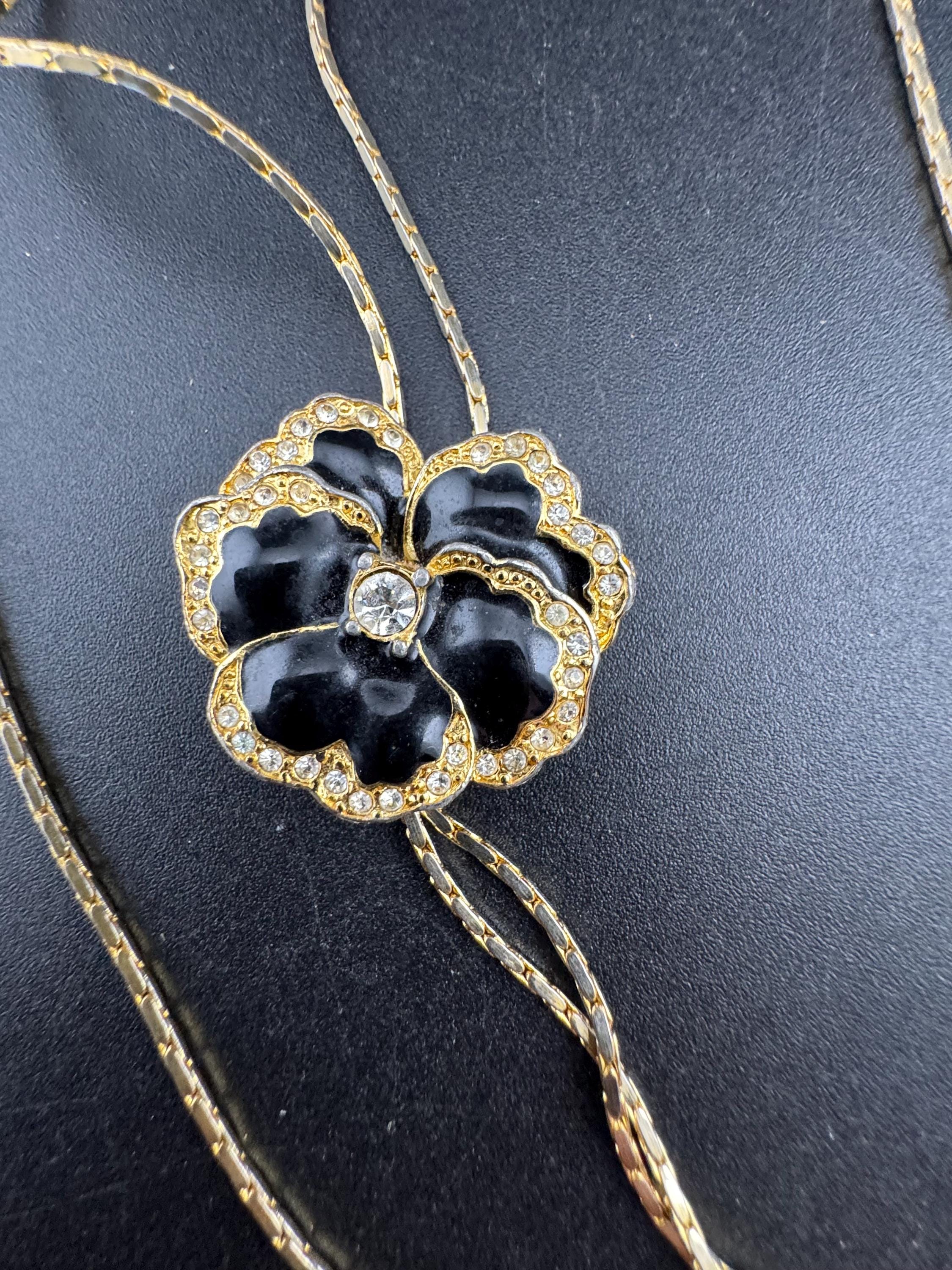 Vintage black enamel and crystal floral slider bolo necklace, with pat no , gold plated