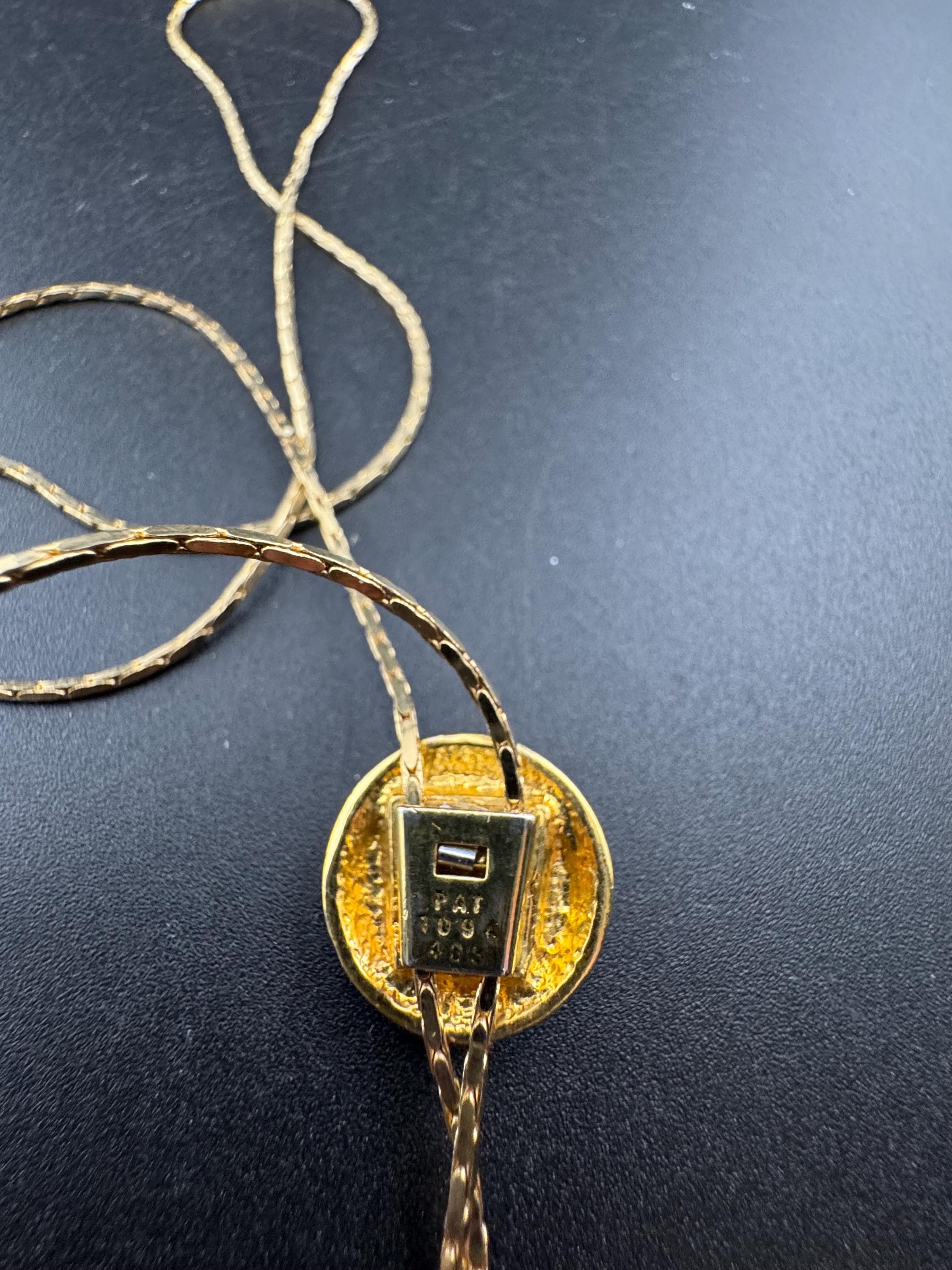 Vintage black enamel and crystal slider bolo necklace, with pat no , gold plated