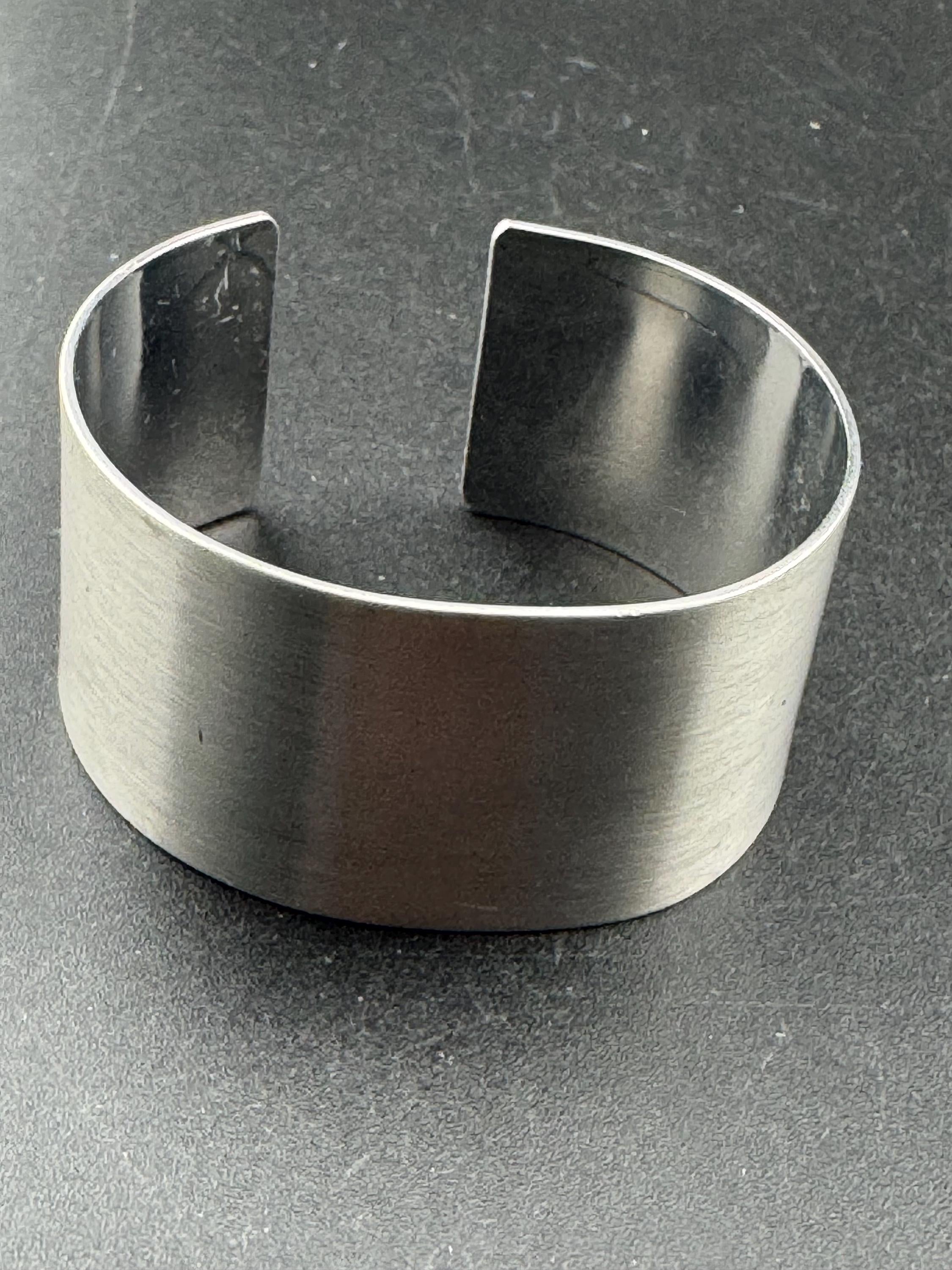 Wide stainless steel modernist bangle, 1970s modernist