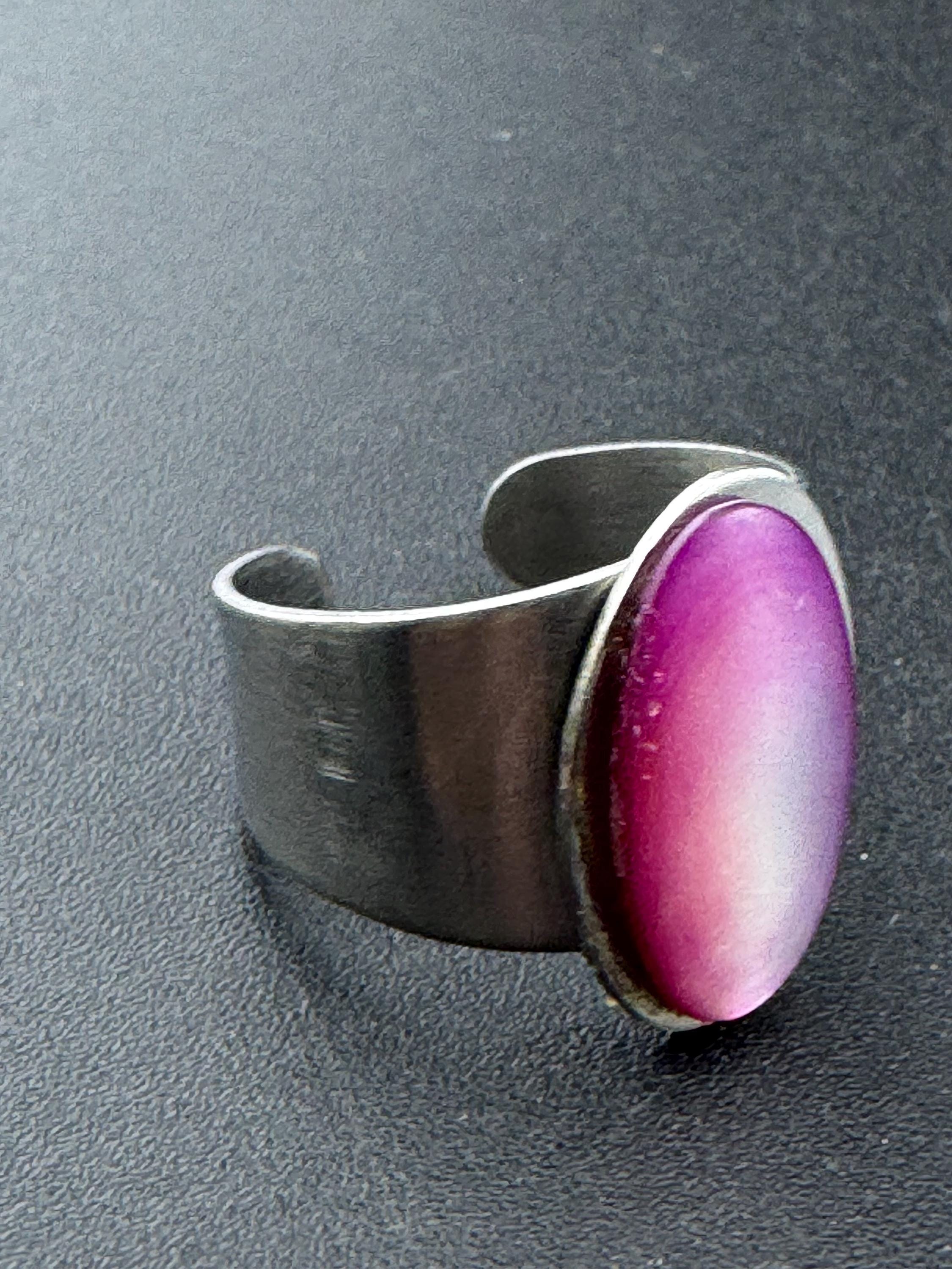 1970s stainless steel adjustable ring, set with pink shell cabochon, vintage