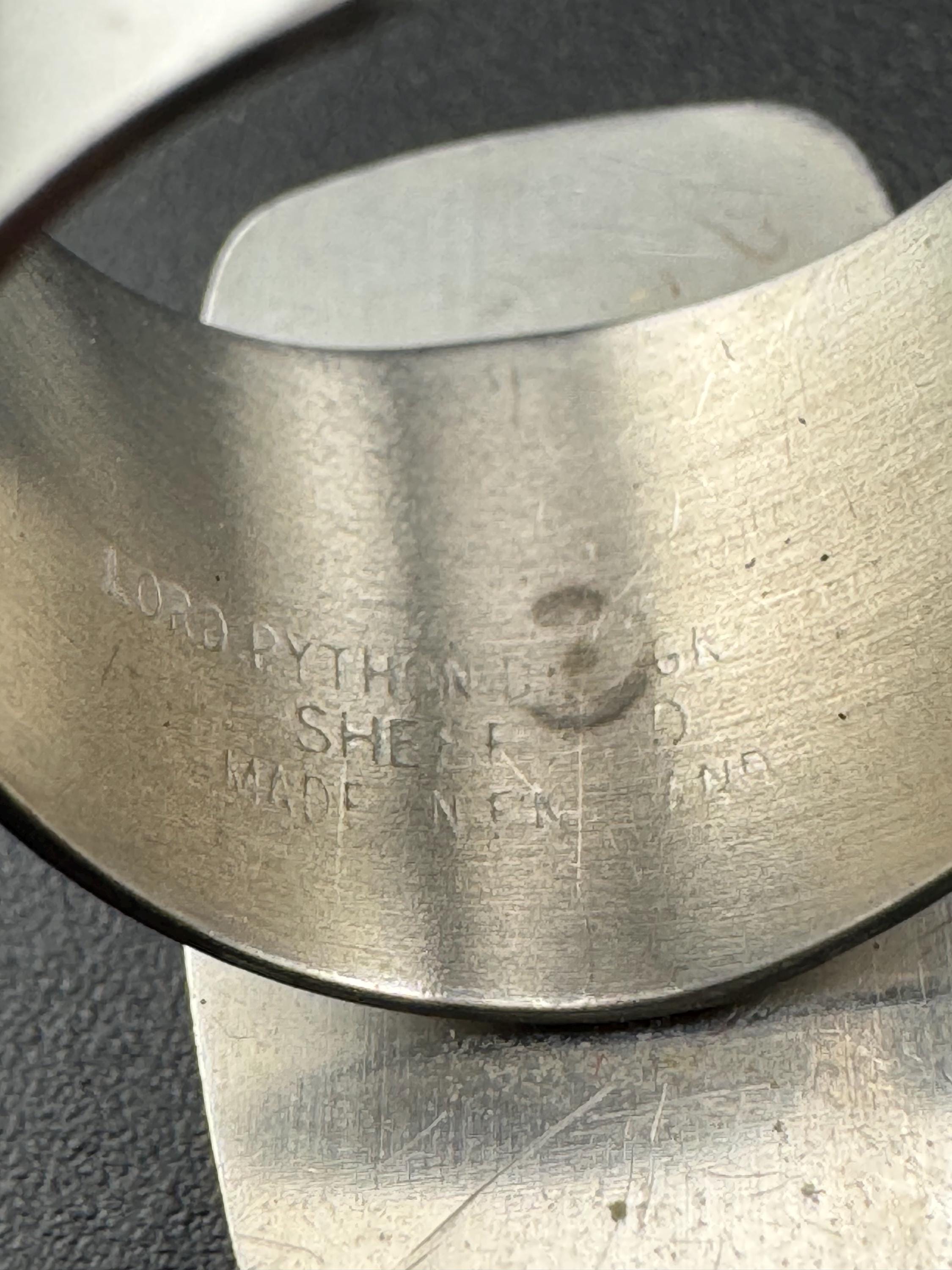 1970s Lord python stainless steel adjustable ring, set with pink shell cabochon, vintage