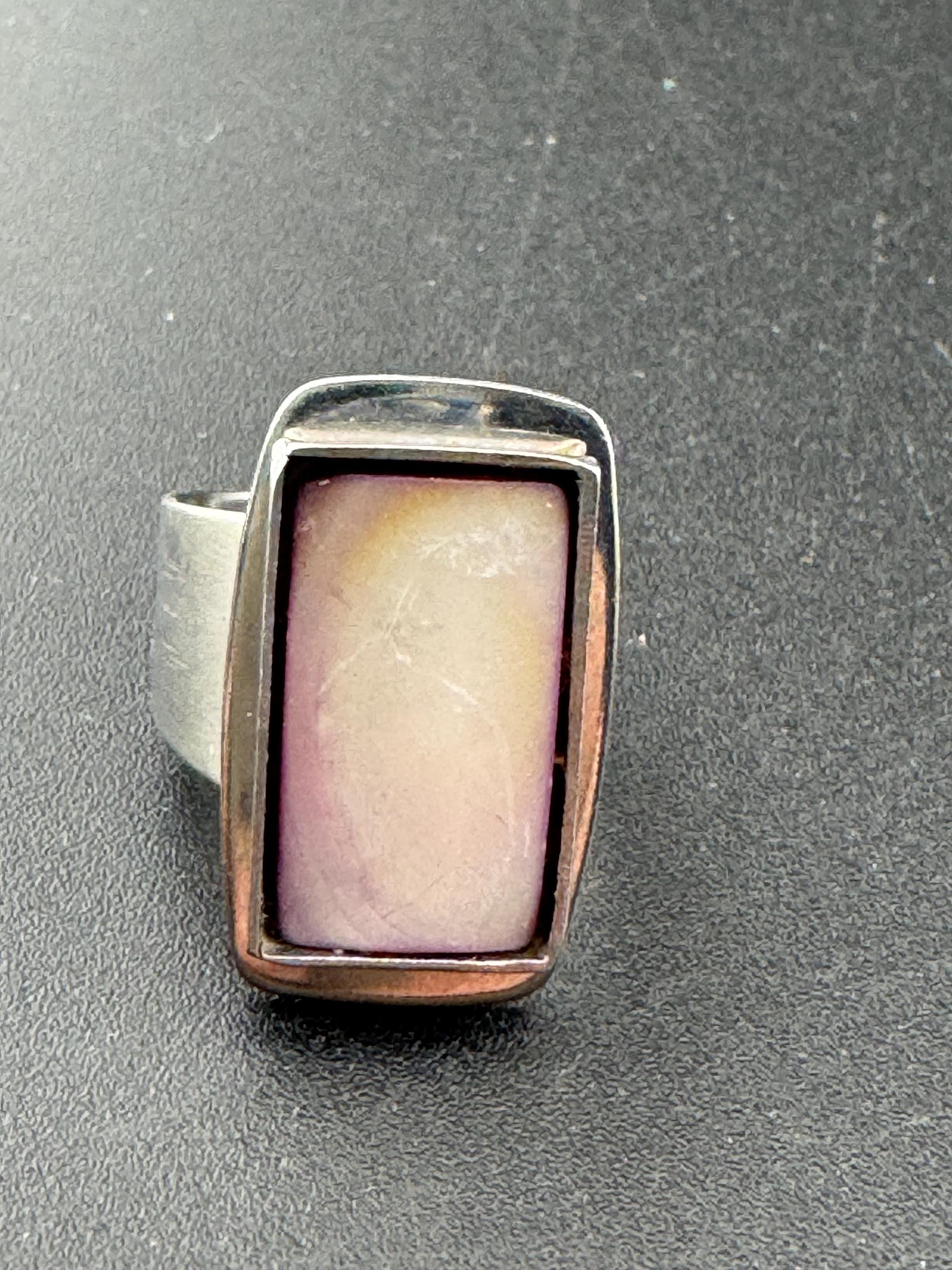 1970s Lord python stainless steel adjustable ring, set with pink shell cabochon, vintage